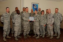 MINOT AIR FORCE BASE, N.D. -- Staff Sgt. Ashley Bailey, 91st Missile Security Forces Squadron commander support staff NCO in charge, is presented with the Minot Chiefs Group Sharp Award for the month of May here June 14. According to the Chief’s Group, Bailey’s dedication of going above and beyond the call of duty while offering exceptional customer service and support to her fellow wingmen in the 91st Missile Wing, were among the many reasons why she was recognized. (U.S. Air Force photo/Airman 1st Class Stephanie Ashley)