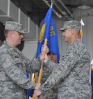 Lt. Col. David Pike (right) receives command of the 911th Air Refueling Squadron from Col. Matthew Molineux, 6th Air Mobility Wing Operations Group commander. A change of command ceremony was held on Friday, June 15, 2012. (USAF photo by Ms. Donna Lea, 916ARW/PA, released)