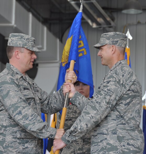 Lt. Col. David Pike (right) receives command of the 911th Air Refueling Squadron from Col. Matthew Molineux, 6th Air Mobility Wing Operations Group commander. A change of command ceremony was held on Friday, June 15, 2012. (USAF photo by Ms. Donna Lea, 916ARW/PA, released)