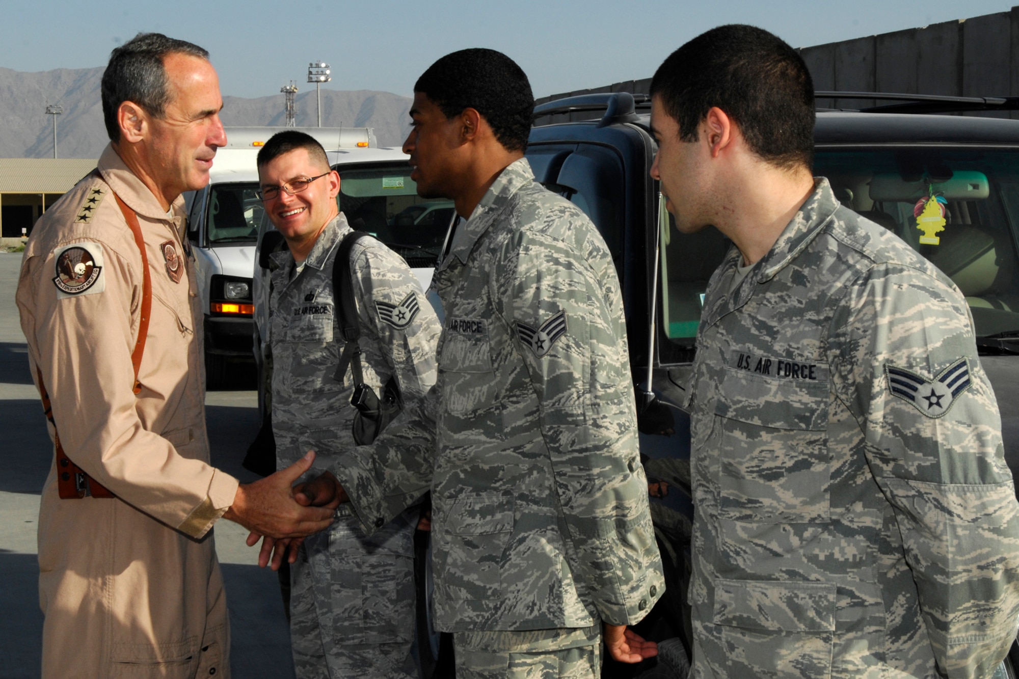 Gen. Raymond Johns Jr., U.S. Air Force Air Mobility Command commander, expresses his appreciation to the Airmen at Bagram Airfield, Afghanistan, June 17, 2012. As Johns was preparing to depart Bagram on Father’s Day, he “coined” members who are fathers and thanked them for their service and sacrifices. (U.S. Air Force photo/Staff Sgt. Jeff Nevison)
