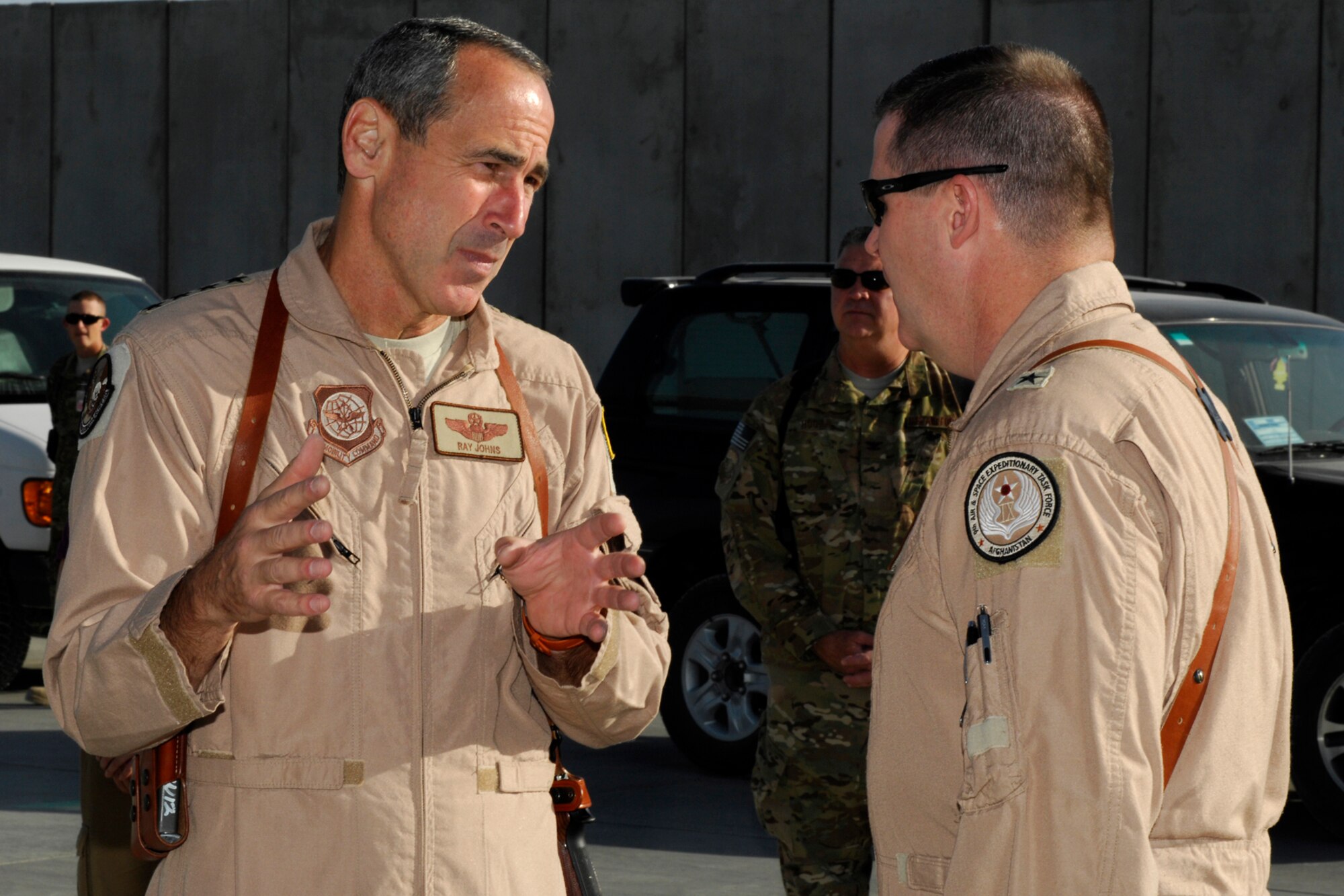 Gen. Raymond Johns Jr., Air Mobility Command commander, talks to Brig. Gen. Thomas Deale, 455th Air Expeditionary Wing commander at Bagram Airfield, Afghanistan, June 17, 2012. Johns and Deale discussed AMC’s support to missions at Bagram which support U.S. and Coalition Forces in Afghanistan. (U.S. Air Force photo/Staff Sgt. Jeff Nevison)