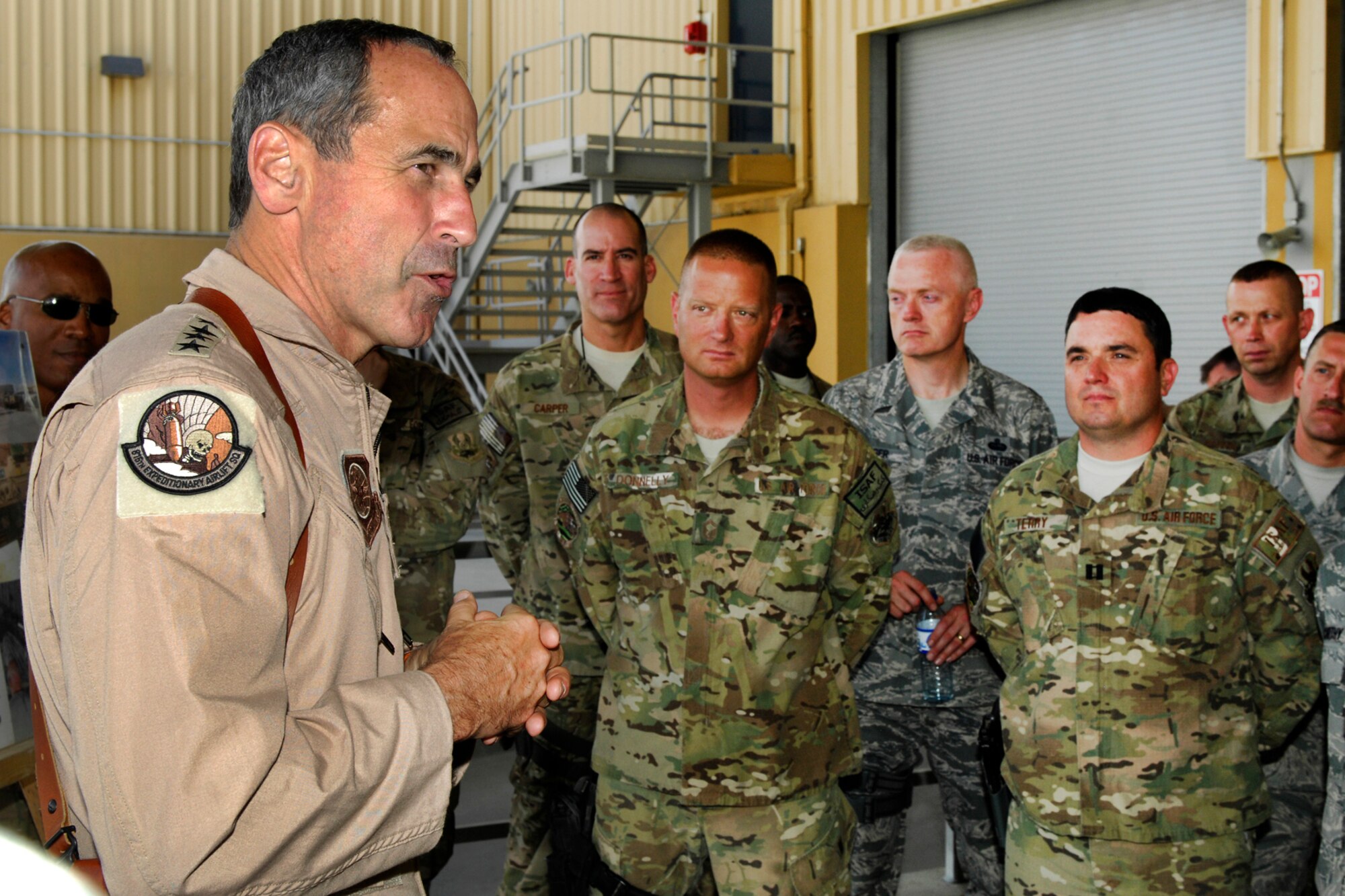 Gen. Raymond Johns, Jr., Air Mobility Command commander, talks to Airmen of the 455th Expeditionary Aerial Port Squadron at Bagram Airfield, Afghanistan, June 16, 2012. Johns expressed his appreciation for their hard work and service in supporting U.S. and Coalition Forces in Afghanistan. (U.S. Air Force photo/Staff Sgt. Jeff Nevison)