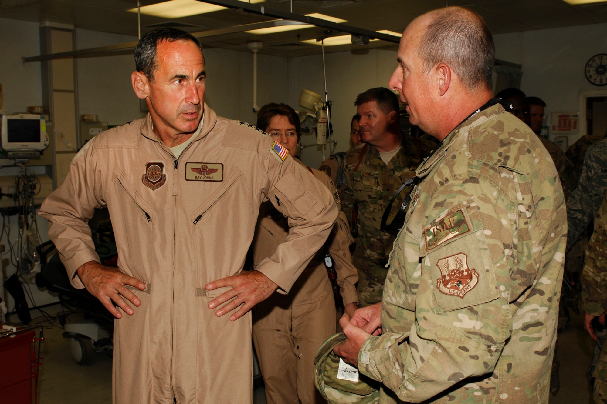Gen. Raymond Johns, Jr., Air Mobility Command commander, listens while Col. Jimmie Bailey, 455th Expeditionary Medical Group commander, talks about the Craig Joint Theater Hospital at Bagram Airfield, Afghanistan, June 16, 2012. Bailey described the level of care the hospital provides to wounded military and local civilians. He explained how a patient’s life expectancy greatly increases when they are treated at CJTH. (U.S. Air Force photo/Staff Sgt. Jeff Nevison)