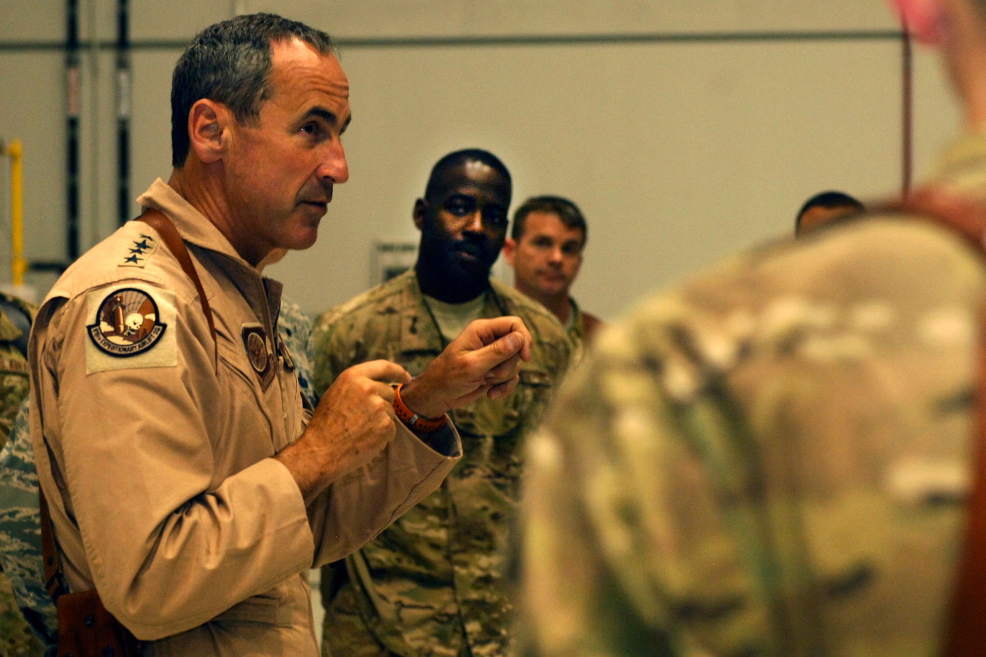 Airmen from the 774th Expeditionary Airlift Squadron listen as Gen. Raymond Johns, Jr., Air Mobility Command commander, expresses his gratitude to the Airmen for their service at Bagram Airfield, Afghanistan, June 16, 2012. Johns also discussed the future of the airlift mission in support of U.S. and Coalition forces in Afghanistan. (U.S. Air Force photo/Staff Sgt. Jeff Nevison)
