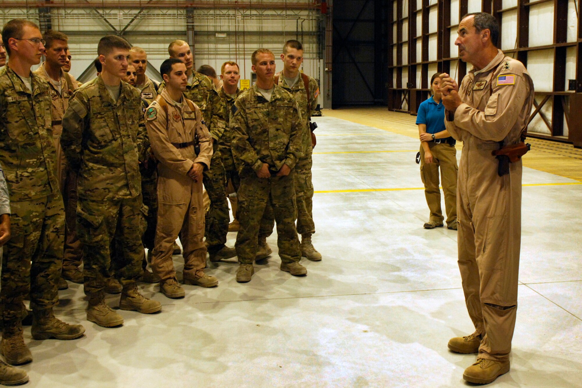 Airmen from the 774th Expeditionary Airlift Squadron listen as Gen. Raymond Johns, Jr., Air Mobility Command commander, expresses his gratitude to the Airmen for their service at Bagram Airfield, Afghanistan, June 16, 2012. Johns also discussed the future of the airlift mission in support of U.S. and Coalition forces in Afghanistan. (U.S. Air Force photo/Staff Sgt. Jeff Nevison)