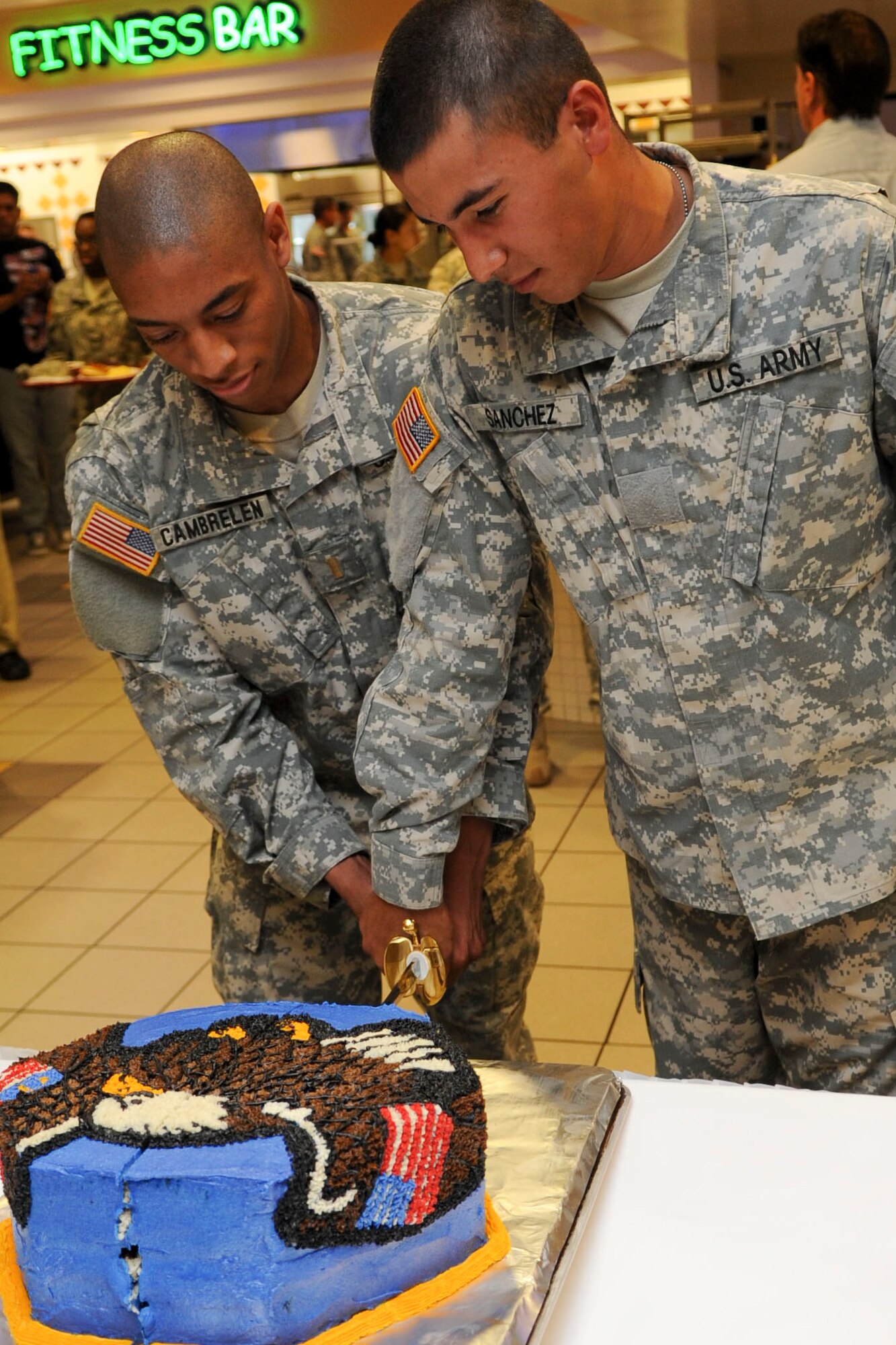 (From Left) U.S. Army Pvt. Guillermo Sanchez, a watercraft engineer student assigned to Echo Company, 244th Quartermaster Battalion at Ft. Lee, Va., and 2nd Lt. Harry Cambrelen, 359th Inland Cargo Transportation Company executive officer, cut the U.S. Army Birthday Cake at the 7th Sustainment Brigade's Resolute Cafe at Ft. Eustis, Va., June 14, 2012. The cake cutting honored the Army's 237th birthday. The Army is the oldest and largest branch of the U.S. Armed Forces. (U.S. Air Force photo by Senior Airman Wesley Farnsworth/Released)