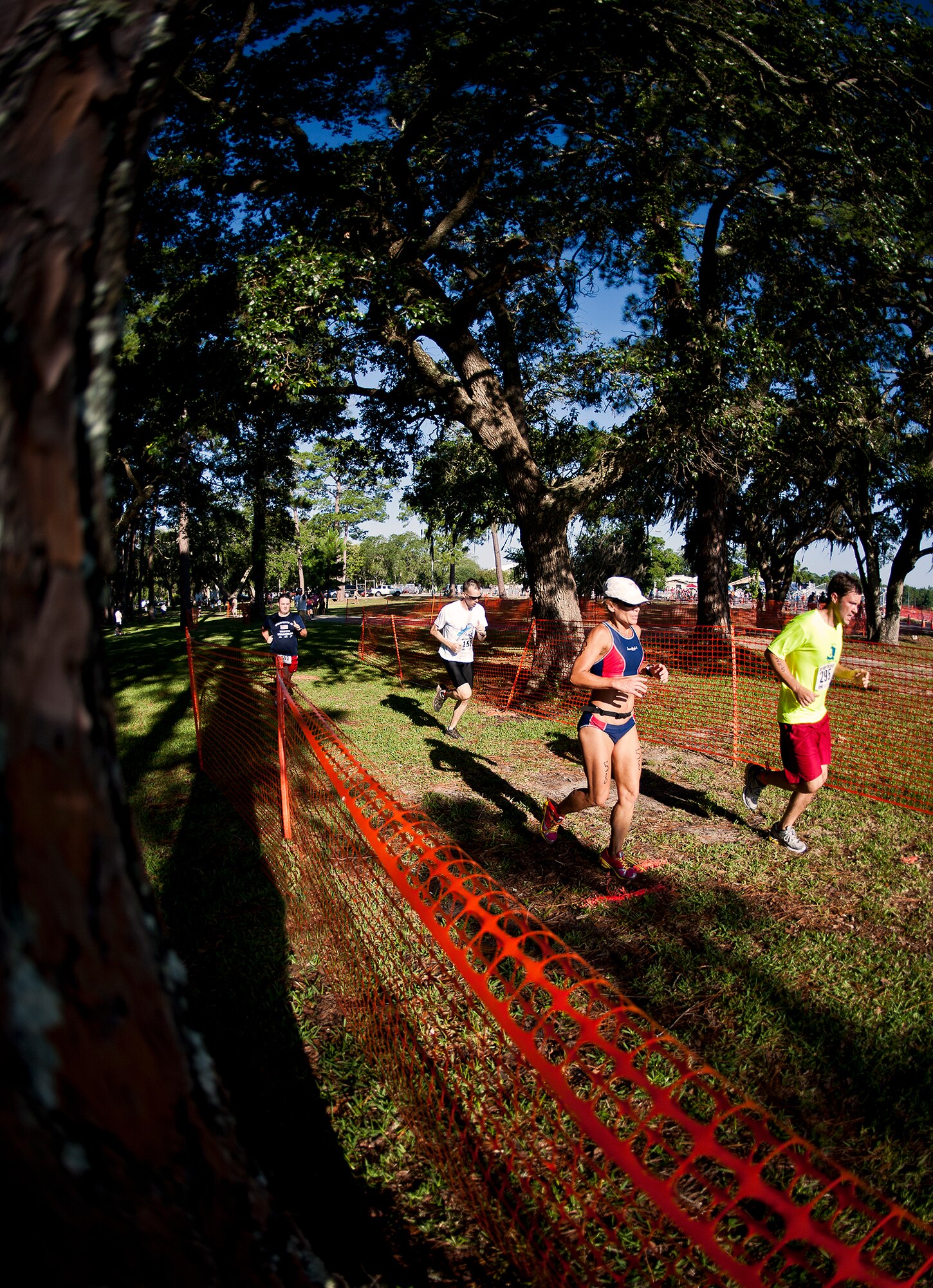 Runners stride to the finish of the two and a half-mile run of the My-First-Tri competition June 16 at Eglin Air Force Base, Fla.  More than 140 people competed in the 13th annual base triathlon.  (U.S. Air Force photo/Samuel King Jr.)