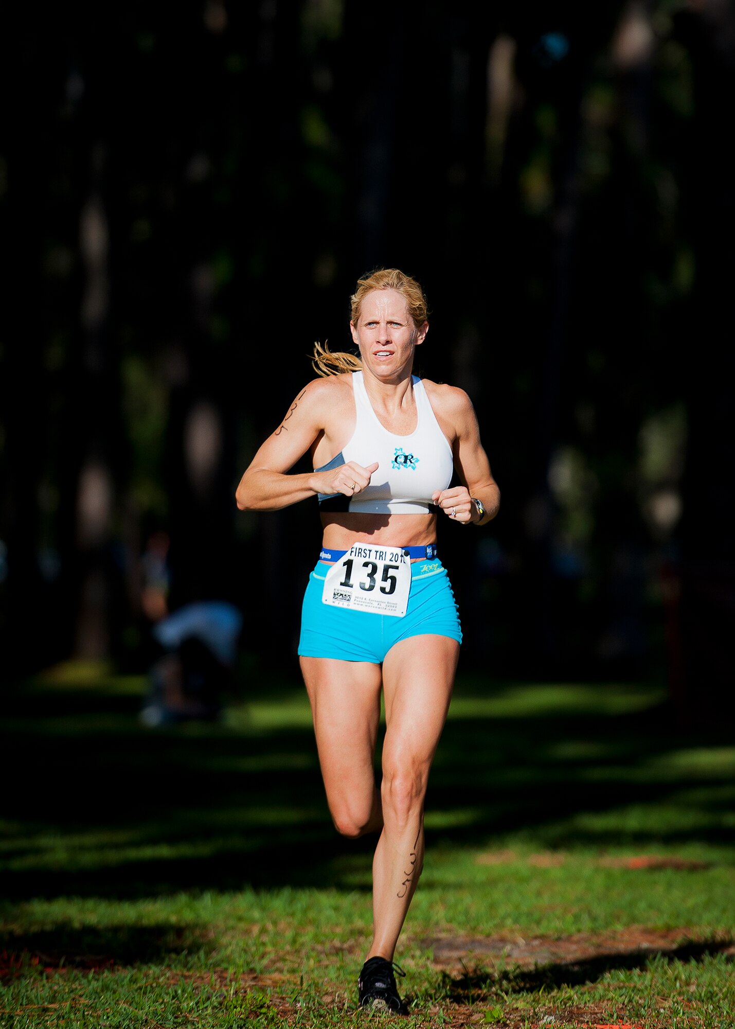 Keri Holguin sprints the last leg of the two and a half-mile run of the My-First-Tri competition June 16 at Eglin Air Force Base, Fla.  More than 140 people competed in the 13th annual base triathlon.  (U.S. Air Force photo/Samuel King Jr.)