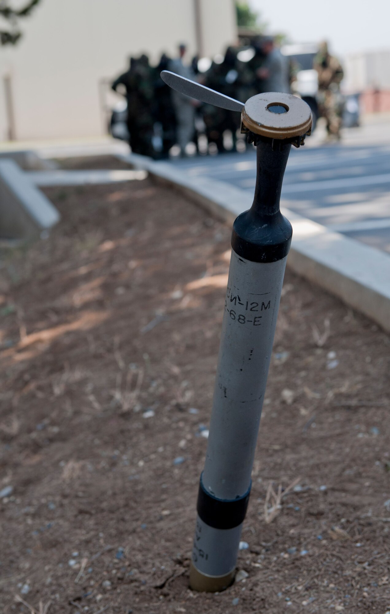 A simulated unexploded ordnance sticks out of the ground during a Phase II Operational Readiness Exercise June 13, 2012, at Incirlik Air Base, Turkey. The simulated UXO was used during a post-attack sweep, done to ensure safety and security after an attack, as part of the exercise. (U.S. Air Force photo by Senior Airman Anthony Sanchelli/Released)
