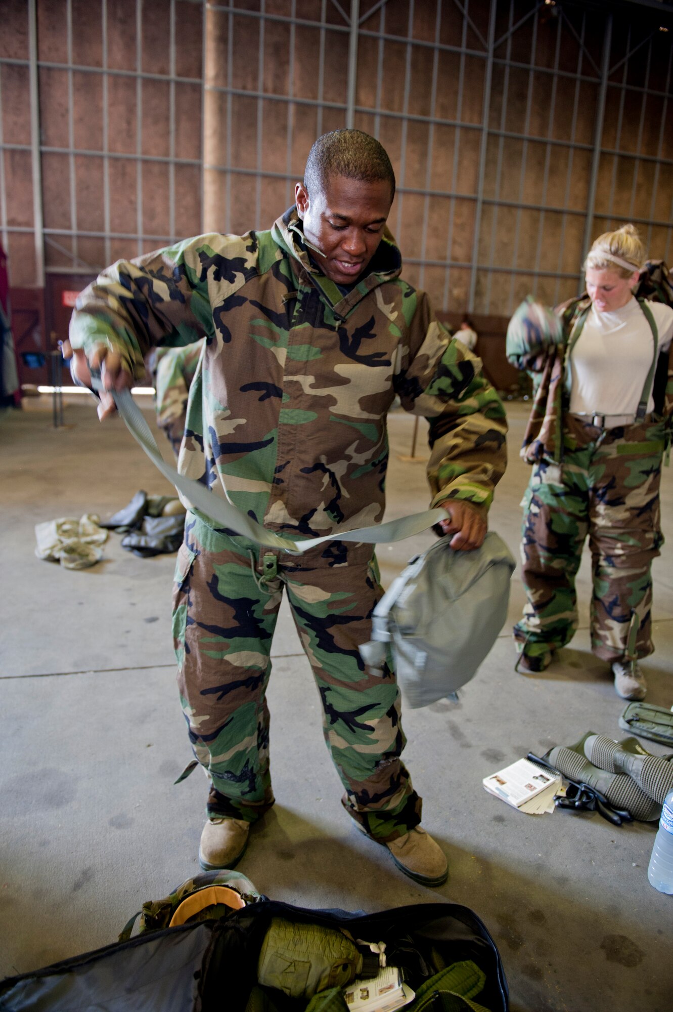 Tech. Sgt. Curtis Hill, 39th Air Base Wing, Wing Staff Agencies executive assistant, dons mission-oriented protective posture gear during a Phase II Operational Readiness Exercise June 13, 2012, at Incirlik Air Base, Turkey. MOPP gear is designed to protect from nuclear, biological, chemical and conventional threats. (U.S. Air Force photo by Senior Airman Anthony Sanchelli/Released)
