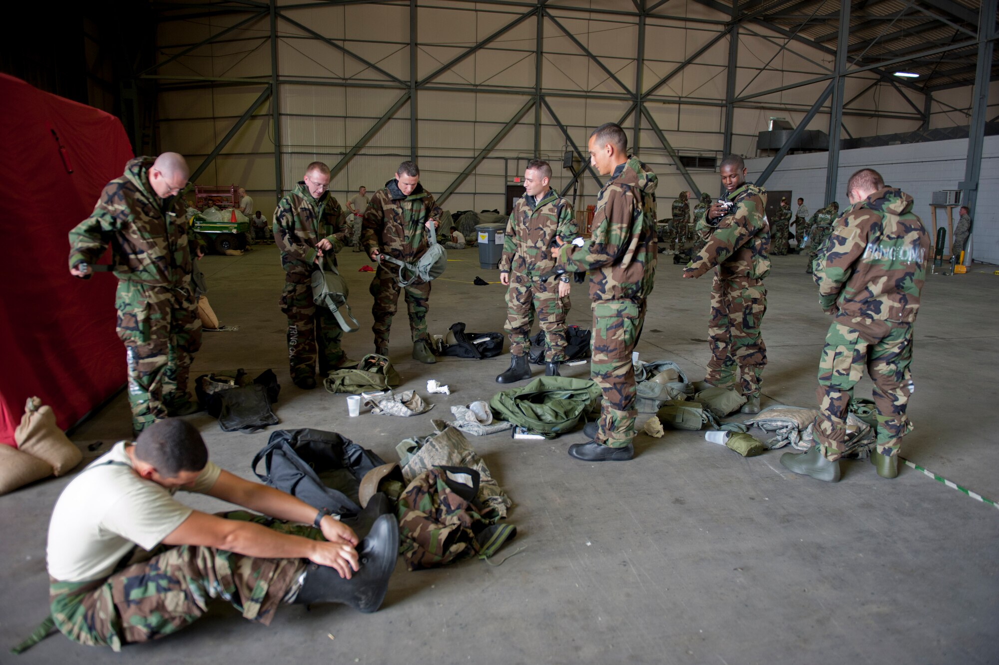 Airmen don mission-oriented protective posture gear during a Phase II Operational Readiness Exercise June 13, 2012, at Incirlik Air Base, Turkey. MOPP gear is designed to protect from nuclear, biological, chemical and conventional threats. (U.S. Air Force photo by Senior Airman Anthony Sanchelli/Released)