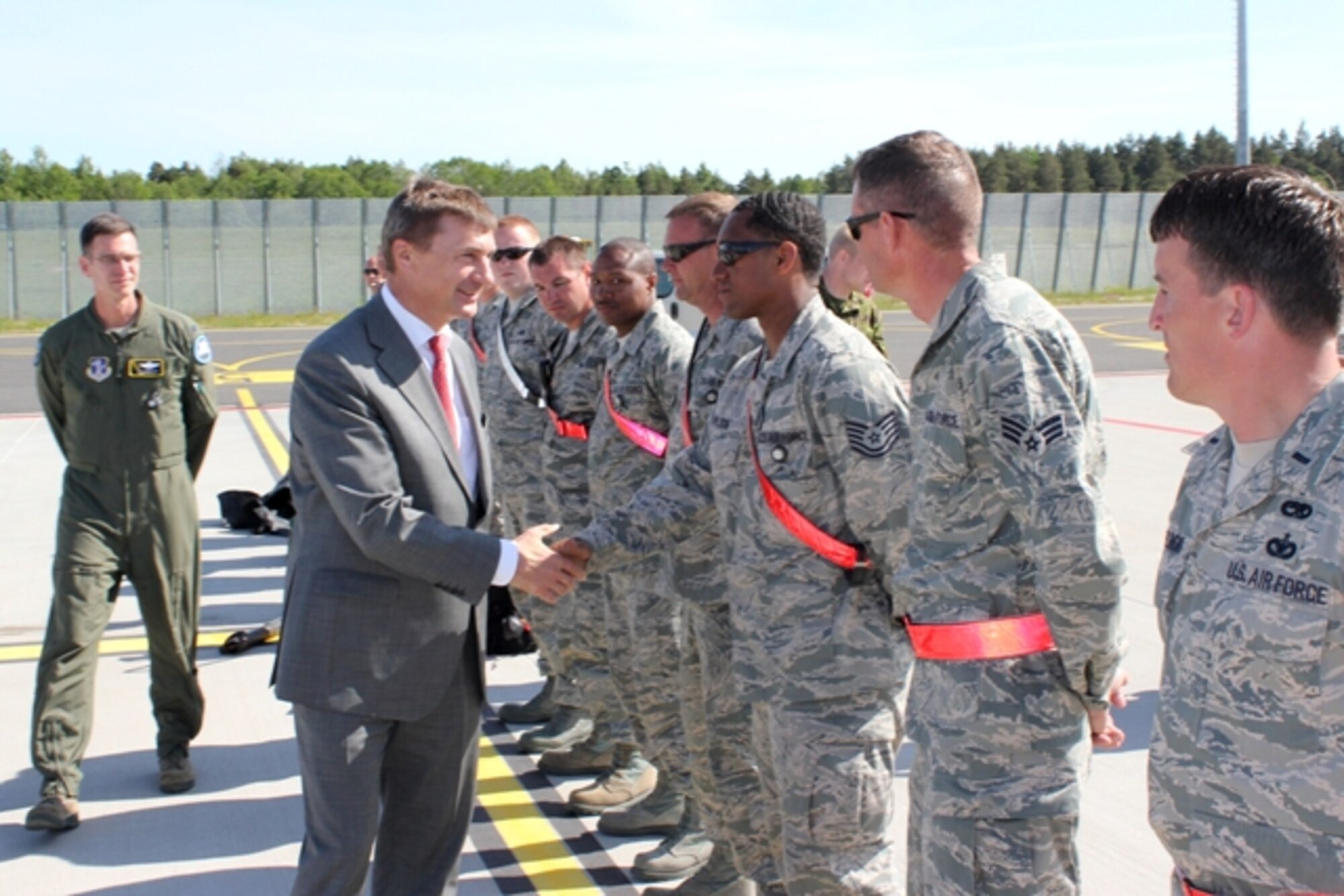 Estonian Prime Minister Andrus Ansip is briefed on the capabilities of a U.S. Air Force KC-135 Stratotanker by Lt. Col. Paul Beck, a pilot with the 171st Air Refueling Squadron. The aircraft was in Estonia for Saber Strike 2012, a multi-national exercise based in Estonia and Latvia. (Air National Guard photo by Tech. Sgt. Dan Heaton)