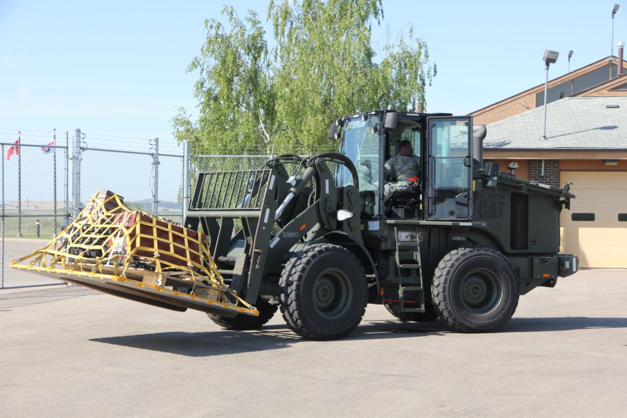 Senior Airman Kevan Graham, 46th Aerial Port Squadron, Dover Air Force Base, Del., maneuvers a cargo vehicle June 1, 2012, during the Maple Flag international air combat exercise in Cold Lake, Alberta, Canada. (Courtesy photo)