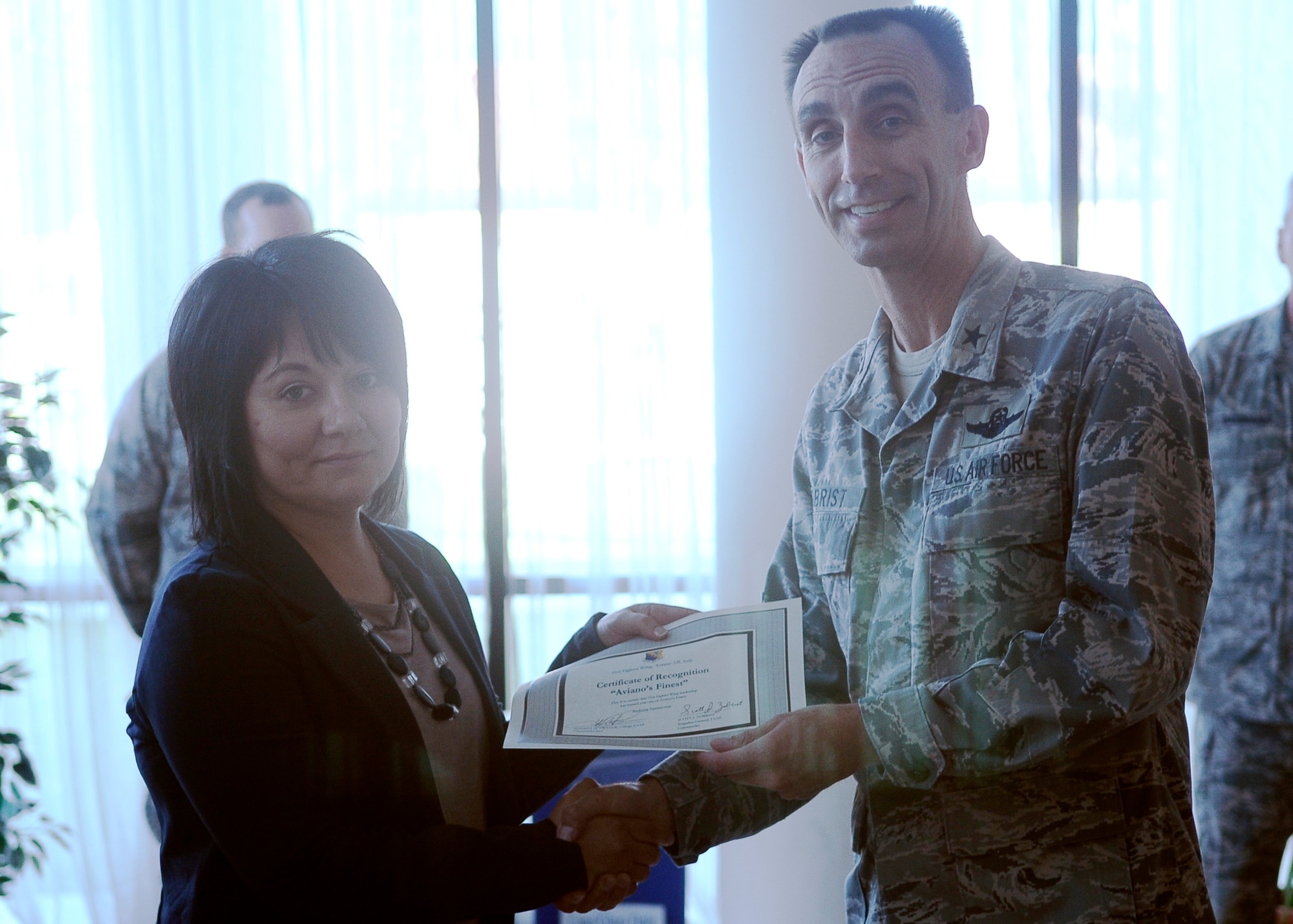 Brig. Gen. Scott J. Zobrist, 31st Fighter Wing commander congratulates Stefania Santrossa 31st Communications Squadron telecommunications specialist, on her selection as one of Aviano’s finest.(U.S. Air Force photo/Airman 1st Class Jenay Randolph)
