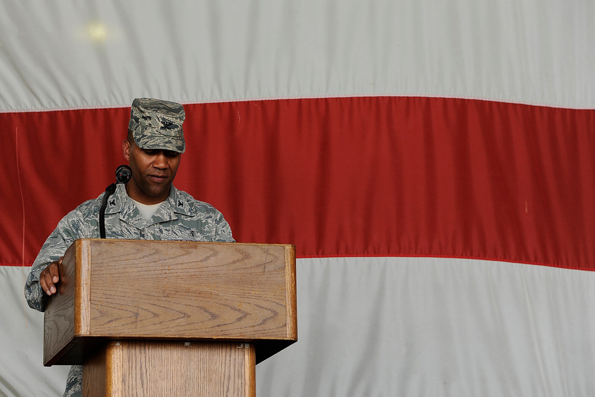 Col. Alvis W. Headen III, 8th Medical Group commander, addresses his group for the last time during the change of command ceremony at Kunsan Air Base, Republic of Korea, June 15, 2012. Headen handed command to Col. Jill Scheckel, who became the group’s newest “Hawk.” (U.S. Air Force photo/Staff Sgt. Rasheen A. Douglas)