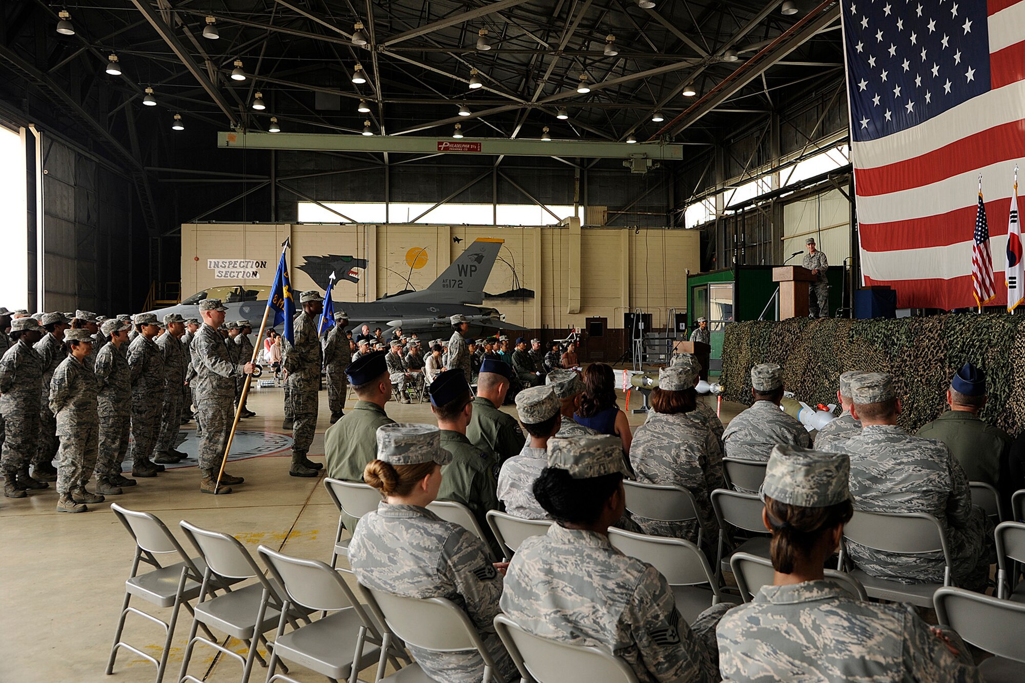 Col. John Pearse, 8th Fighter Wing commander, addresses members of the Wolf Pack during a change of command ceremony on Kunsan Air Base, Republic of Korea, June 15, 2012. The ceremony marks the official acceptance of Col. Jill Scheckel as the 8th Medical Group’s newest commander. (U.S. Air Force photo/Staff Sgt. Rasheen A. Douglas)