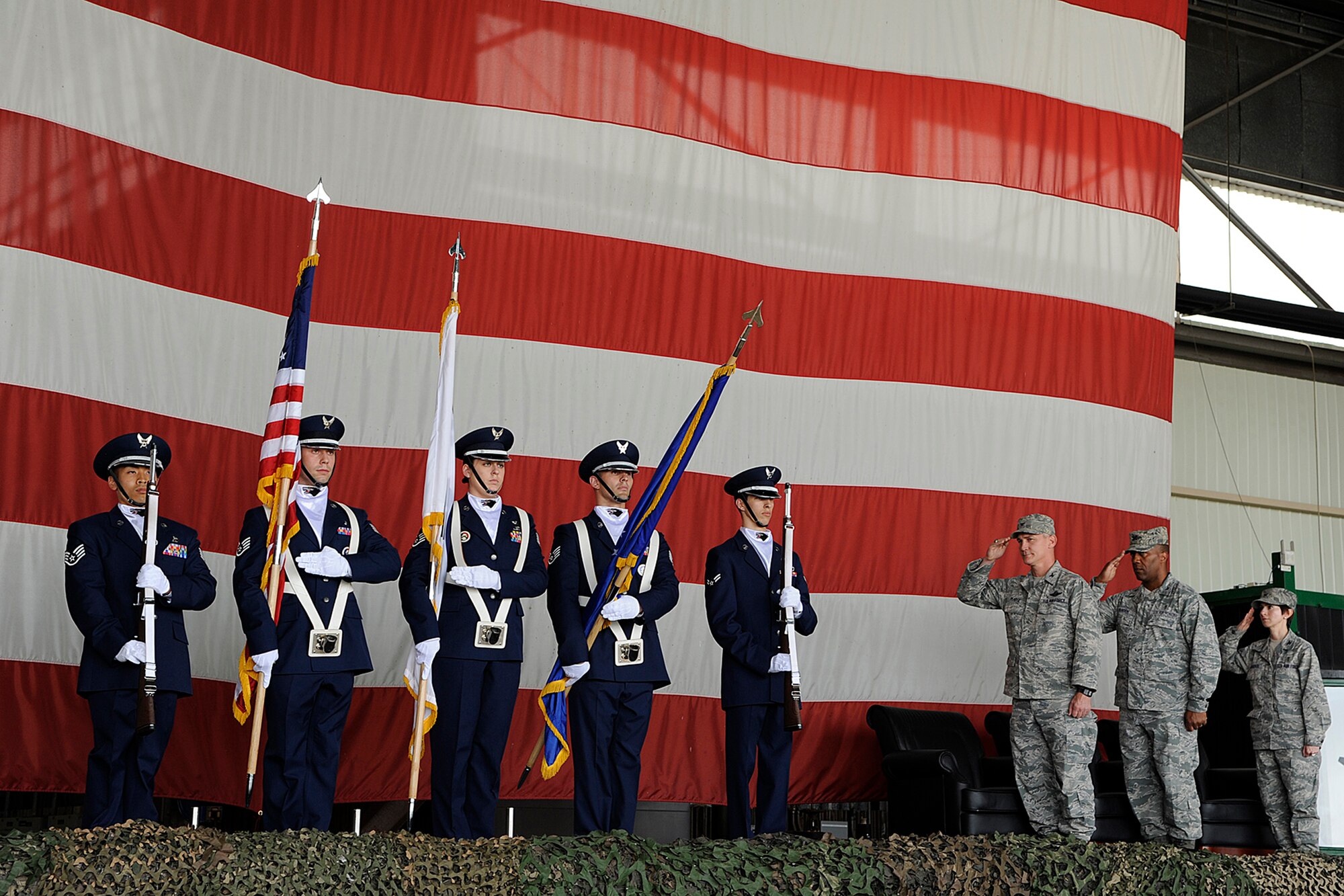 Members of the 8th Fighter Wing Honor Guard prepare to present the colors during the 8th Medical Group change of command ceremony on Kunsan Air Base, Republic of Korea, June 15, 2012. Col. Alvis W. Headen III handed over command to Col. Jill Scheckel, who is the wing’s newest “Hawk.” (U.S. Air Force photo/Staff Sgt. Rasheen A. Douglas)