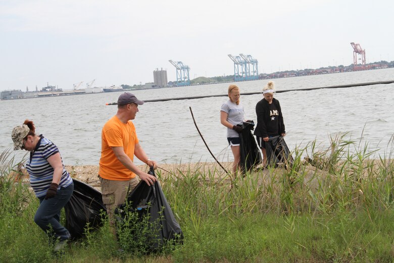 PORTSMOUTH, Va. -- More than 23 employees and family members from the Norfolk District participated in Clean the Bay Day June 2, 2012. Clean the Bay Day is a statewide initiative organized by the Chesapeake Bay Foundation, in conjunction with municipalities, businesses and government agencies working together to restore the Chesapeake Bay and its rivers and streams. Every year since 1989, thousands of citizens throughout the Commonwealth of Virginia have dedicated their time to clear litter from waterways. Norfolk District employees volunteered three hours of their time today to remove debris from the shorelines of the Craney Island Dredged Material Management Area, which is operated and maintained by the district. CIDMMA is a 2,500-acre confined dredged material disposal site on the north side of Portsmouth, Va. It serves as an economical and environmentally sustainable repository for material dredged within the federal waterways of the Hampton Roads harbor. 