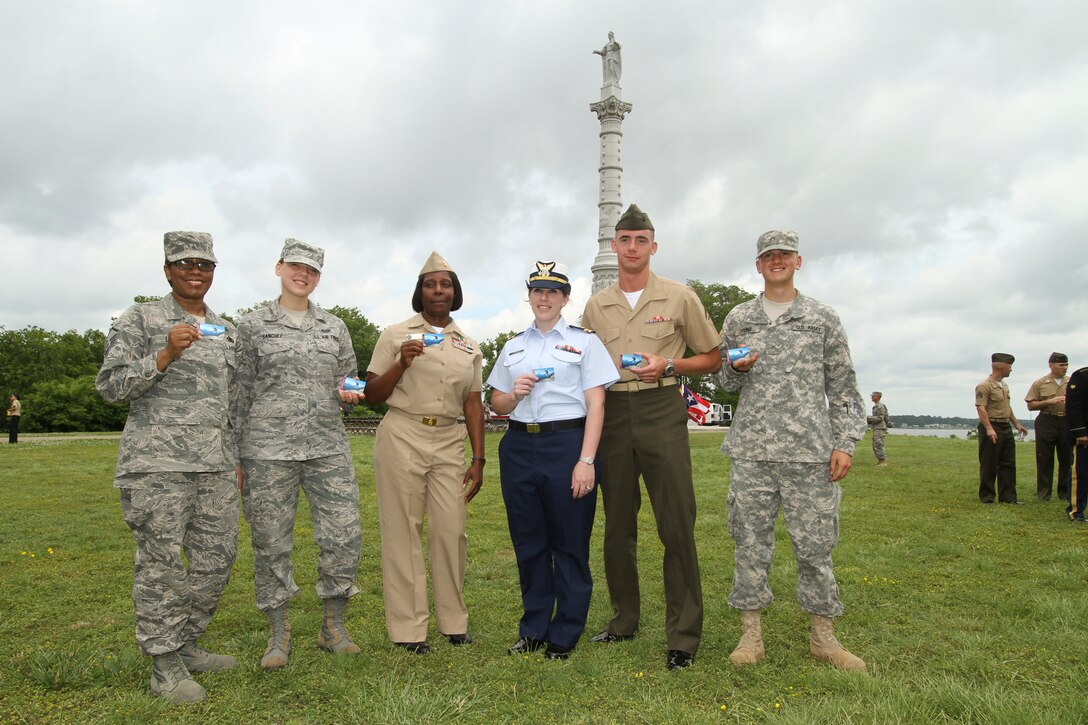 Master Sgt. Natalie Lucas, Airmen Audri Sanchez, Chief Latesha Mazyck, Lt. Rachael Strebel, LCpl. William Brewer,  PVT2  Colton Young, show off their new America the Beautiful Passes given to them as part of the new pass program for all active military, May 5, 2012. The pass allows all military and their families to go to federal parks for free and is good for more than 2,000 federal recreation sites nationwide. The pass program is part of the first lady’s Joining Forces initiative to unite society in support of military members and their families. 