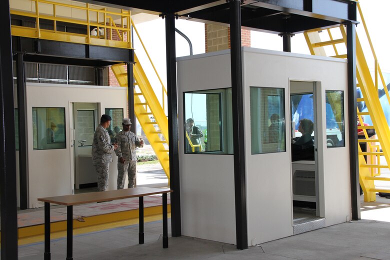 People explore the new Large Vehicle Inspection Station before the station's ribbon-cutting ceremony May 4, 2012. The inspection station; construction of which was overseen by Norfolk District, U.S. Army Corps of Engineers; will provide administrative and indoor inspection capabilities for commercial vehicles entering Joint Base Langley-Eustis. The 9,000-square foot inspection station will allow the Air Force to inspect all commercial traffic while preserving the primary entrance to the base for visitor and private vehicle entrance. The facility meets the minimum standards required to meet LEED Silver certification.