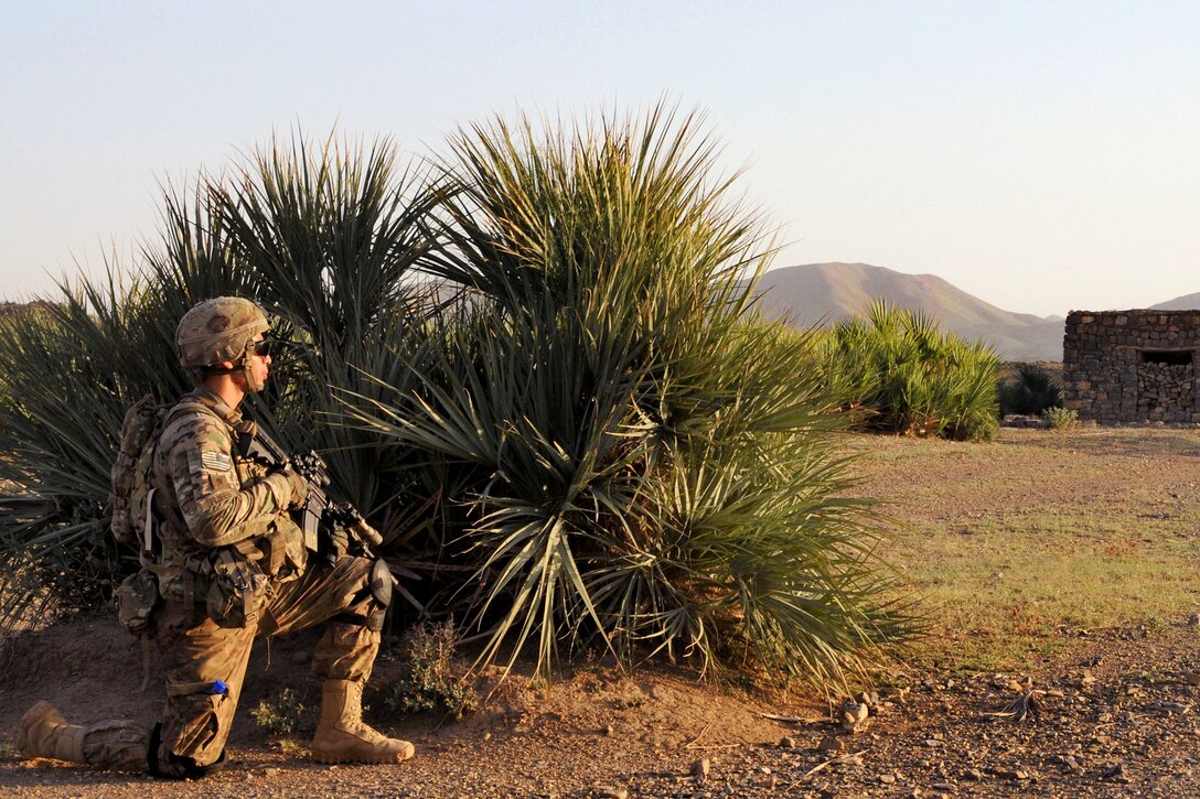 U.S. Army Pfc. Jonathan Flores pulls security during a dismounted patrol in Towgo Ghar village in Afghanistan's Khowst province, June 9, 2012. Flores, a rifleman, is assigned to Company B, 1st Battalion, 501st Infantry Regiment.