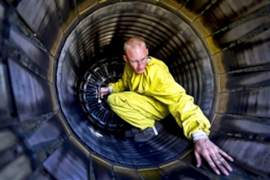 U.S. Air Force Staff Sgt. Greg Penrod performs an exhaust inspection on an F-16 Fighting Falcon during Red Flag-Alaska 12-2 on Eielson Air Force Base, Alaska, June 14, 2012. Penrod, a crew chief, is assigned to the 20th Aircraft Maintenance Squadron, Shaw Air Force Base, S.C.