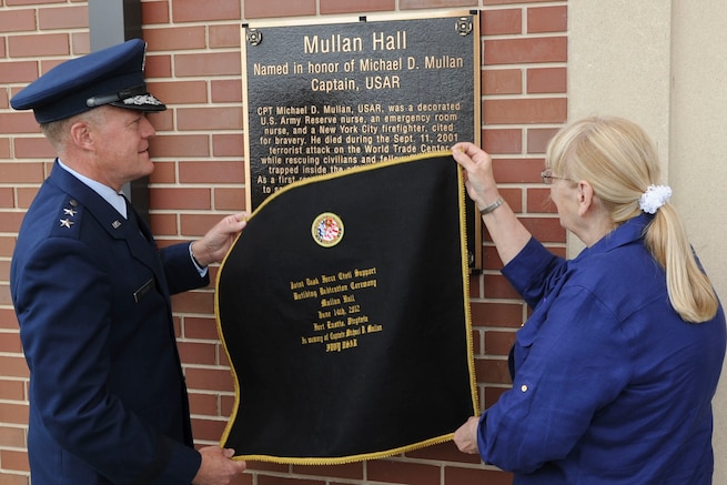 U.S. Air Force Maj. Gen. Jonathan T. Treacy, Joint Task Force-Civil Support commander, and Theresa Mullan, ceremonially unveil the memorial plaque dedicating the JTF-CS headquarters as “Mullen Hall,” in a ceremony at Ft. Eustis, Va., June 14, 2012. The building is named in honor of Theresa's son, the late U.S. Army Capt. Michael D. Mullan, a reservist, emergency-room nurse and decorated New York City firefighter who died while attempting to rescue fellow firefighters from the Marriott Hotel adjacent to the World Trade Center towers during the terrorist attacks of Sept. 11, 2001. (U.S. Air Force photo by Senior Airman Wesley Farnsworth/Released)