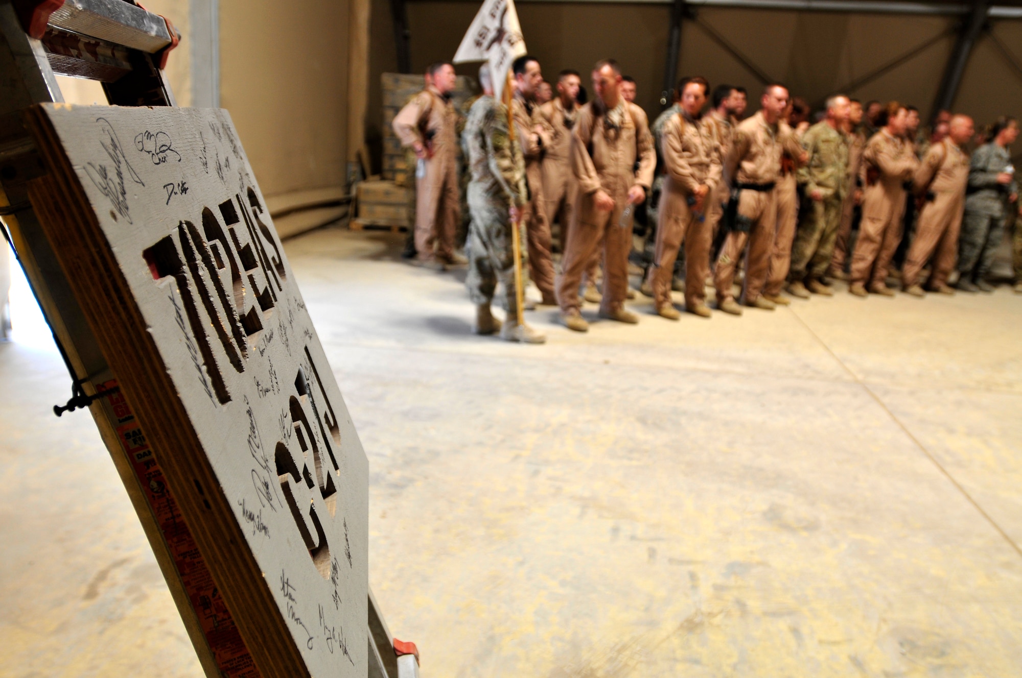 Aircrew and ground support personnel of the 702nd Expeditionary Airlift Squadron form up for their deactivation ceremony at Kandahar Airfield.  The squadron was established in July 2011 and was deactivated on Monday.  The squadron supported tactical airlift requirements in support of operations in Afghanistan (U.S. Army Photo - Sgt. Daniel J. Schroeder)