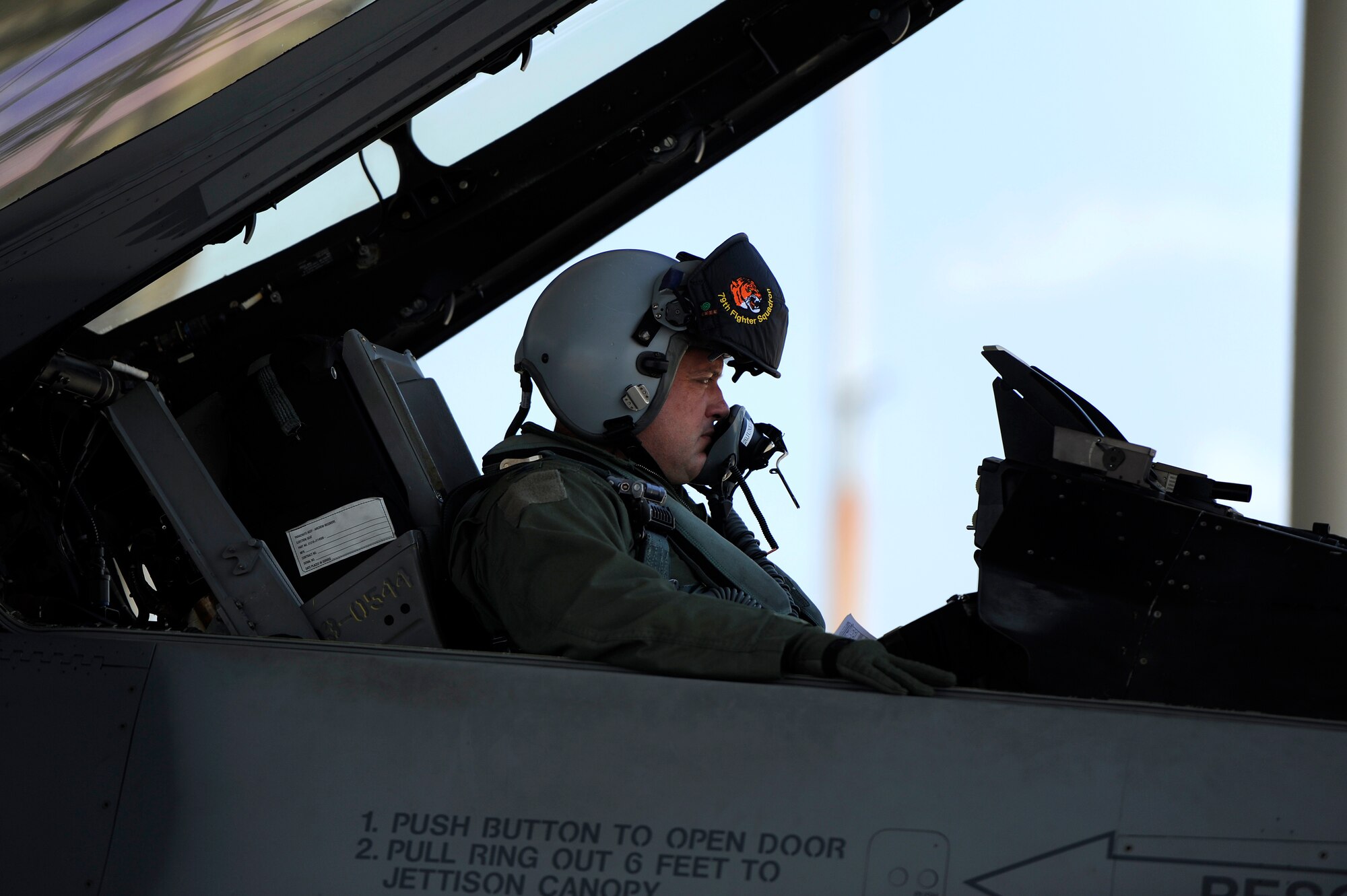 U.S. Air Force Col. Don Godier, 20th Fighter Wing vice commander, sits in the cockpit of his F-16 Fighting Falcon while his crew chiefs finish last minute checks on his aircraft before takeoff, June 19, 2012, Shaw Air Force Base, S.C. The flight was Godier’s last with the 20th FW before moving on to his next assignment at Osan Air Base, South Korea. (U.S. Air Force photo by Senior Airman Kenny Holston)