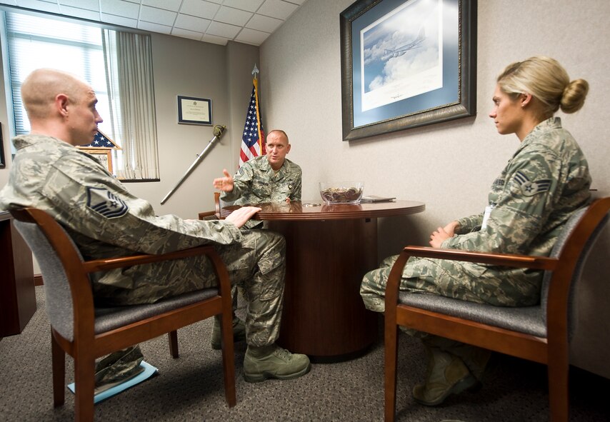 Chief Master Sgt. Brian Hornback, Air Force Global Strike Command command chief, speaks to Master Sgt. Bradley Williams, 2011 Air Force 12 Outstanding Airmen of the Year selectee, and Senior Airman Bryenna Brooks, 2012 Air Force 12 OAY selectee on Barksdale Air Force Base, La., June 19. Brooks and the other 11 recipients will be honored at an event in Washington, D.C., Sept. 15 to 20. The Chief Master Sergeant of the Air Force, a general officer and selected Major Command chiefs form the 12 OAY selection board, and the Air Force Chief of Staff reviews the selections. Selectees also serve on the Air Force Enlisted Council for one year. (U.S. Air Force photo/Staff Sgt. Chad Warren)(RELEASED)