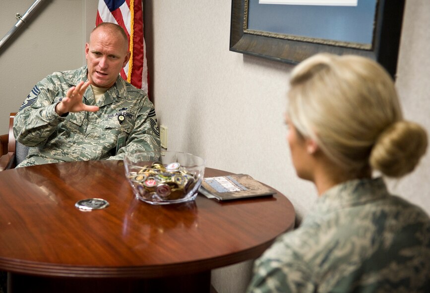 Chief Master Sgt. Brian Hornback, Air Force Global Strike Command command chief, speaks to Senior Airman Bryenna Brooks, 2nd Medical Operations Squadron, about her recent selection to the 2012 Air Force 12 Outstanding Airmen of the Year on Barksdale Air Force Base, La., June 19. Brooks and the other 11 recipients will be honored at an event in Washington, D.C., Sept. 15 to 20. The Chief Master Sergeant of the Air Force, a general officer and selected Major Command chiefs form the 12 OAY selection board, and the Air Force Chief of Staff reviews the selections. Selectees also serve on the Air Force Enlisted Council for one year. (U.S. Air Force photo/Staff Sgt. Chad Warren)(RELEASED)