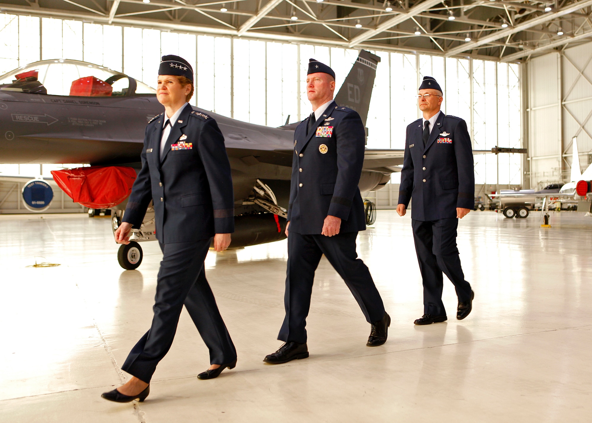 (From left to right) Gen. Janet Wolfenbarger, Air Force Materiel Command commander, Brig. Gen. Robert C. Nolan II, outgoing Air Force Flight Test Center commander, and Brig. Gen. Arnold W. Bunch Jr., incoming AFFTC commander, prepare to walk to the stage in order to commence the AFFTC change of command ceremony held in Hangar 1600 June 19.