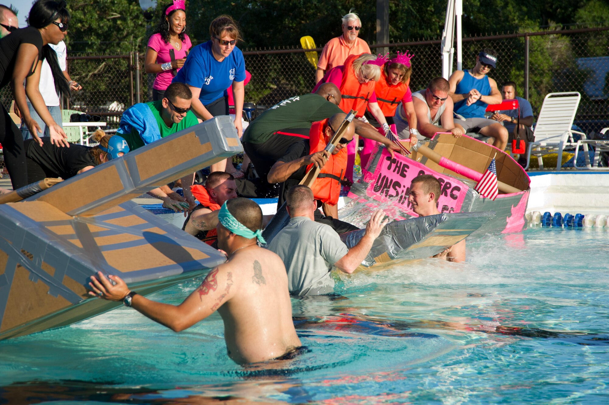 The first heat of the cardboard boat regatta launches at the Triangle Pool June 16, 2012, Keesler Air Force Base, Miss. Participants raced boats made only of cardboard and tape, crewed by two team members.  Team SeaBee took first place in the event. (U.S. Air Force photo by Adam Bond)