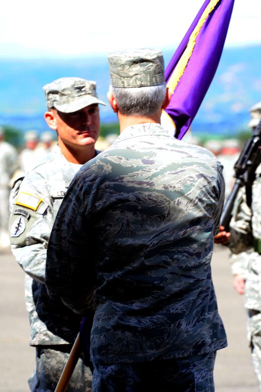 Col. Guy A LeMire receives the Joint Task Force Bravo colors from Gen. Douglas M. Fraser, Commander, U.S. Southern Command during a change of command ceremony at Soto Cano Air Base, Honduras, June 19. LeMire replaced Col. Ross A. Brown, who is leaving to take a position at the Pentagon. (Air Force photo by Martin Chahin)