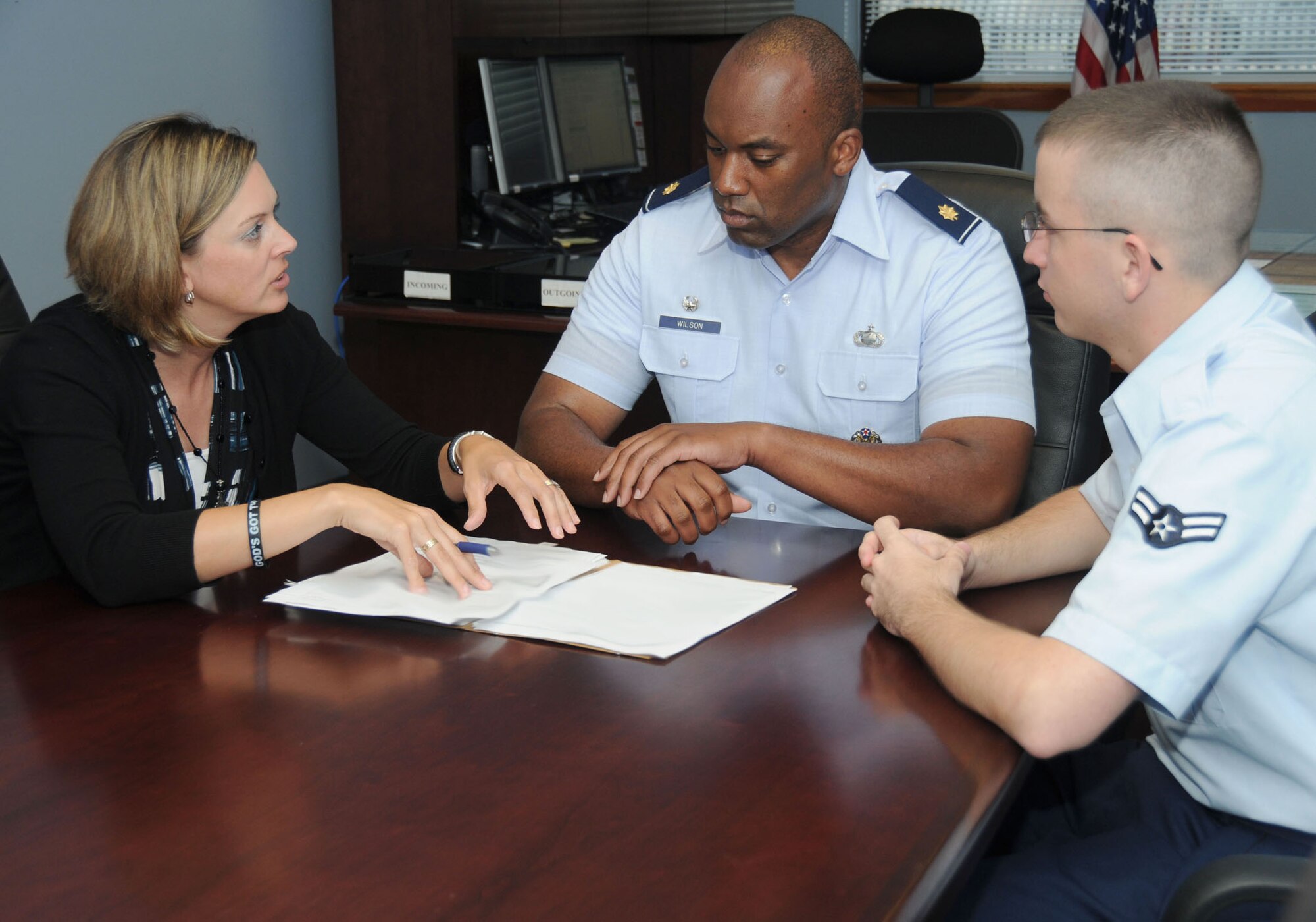 Members of the 81st Contracting Squadron Kimberley Alvarez, Maj. David Wilson II, commander, and Airman 1st Class Jacob Oakes discuss a current contract June 18, 2012, at the contracting office, Keesler Air Force Base, Miss.  Wilson has been selected for the promotion to Lt. Col. There were 1,269 majors selected for promotion to lieutenant colonel during the 2012A line of the Air Force and LAF-judge advocate central selection boards, Air Force Personnel Center officials announced. The boards considered 6,639 majors for promotion.  (U.S. Air Force photo by Kemberly Groue)
