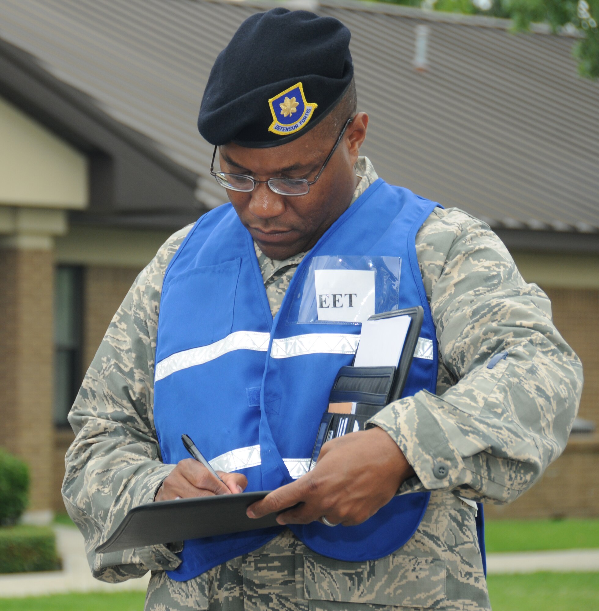 Maj. Tracy McIntosh, 81st Security Forces Squadron exercise evaluation team member, documents exercise events during Keesler's active shooter exercise, June 12, 2012, at the Arnold Annex, Keesler Air Force Base, Miss. The two-day exercise consisted of a lone gunman opening fire with four people killed and 32 injured. The exercise tested the base's ability to respond and recover from a mass casualty event.  (U.S. Air Force photo by Kemberly Groue)