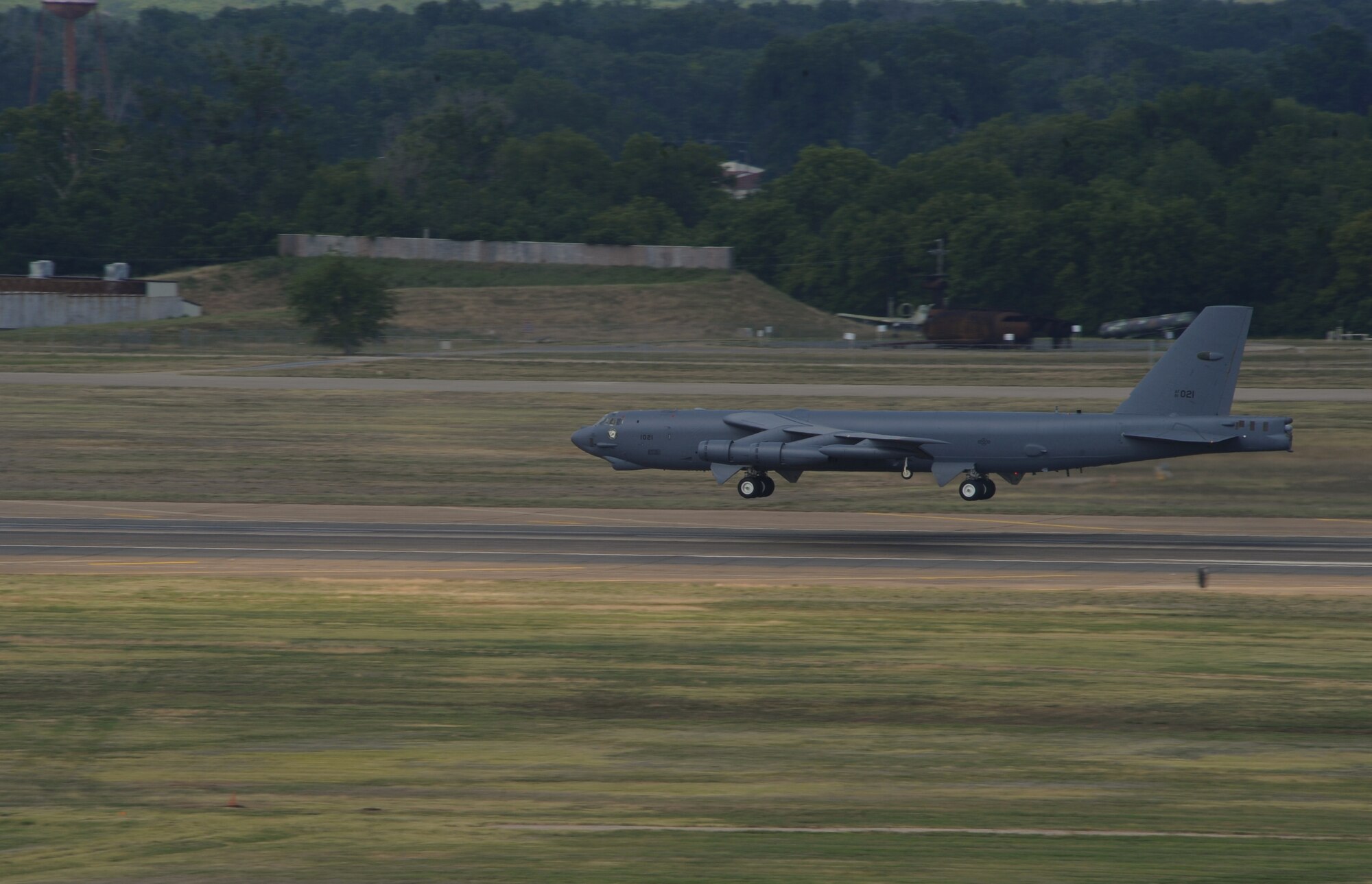 A B-52H Stratofortress performs a touch-and-go landing during an exercise at Barksdale Air Force Base La., June 5. A touch-and-go landing involves the aircraft landing on the runway for a brief moment and then taking off again. The aircraft will never come to a complete stop nor will it deploy its chute when performing this maneuver. The 2nd Bomb Wing conducts training exercises to constantly refine and improve operational procedures and capabilities. (U.S. Air Force photo/Airman 1st Class Benjamin Gonsier)(RELEASED)

