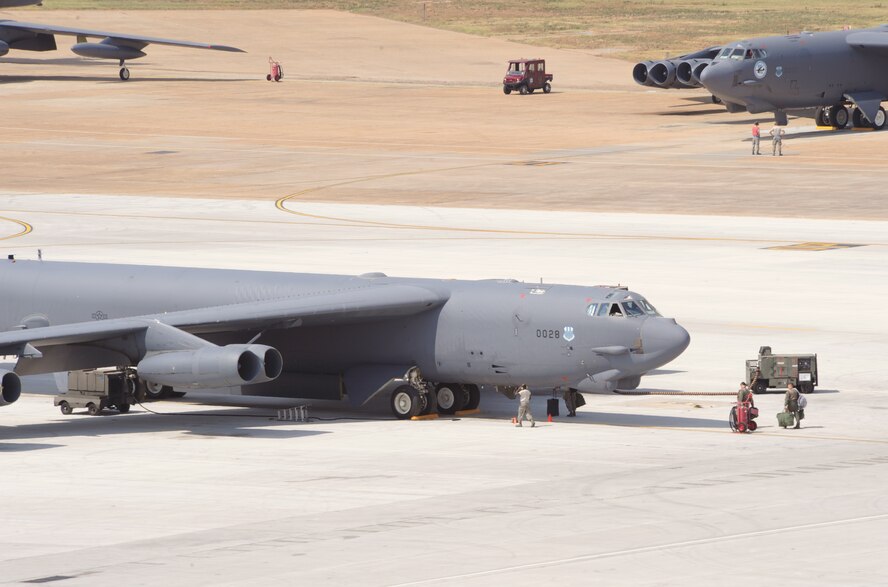 Airmen from the 2nd Aircraft Maintenance Squadron prepare several B-52H Stratofortress bombers for takeoff during an exercise at Barksdale Air Force Base, La., June 5. The 2nd Bomb Wing conducts training exercises to constantly refine and improve operational procedures and capabilities.  Realistic training during wing exercises is critical to the wing's ability to respond quickly and efficiently to real world situations, and is a vital part of Air Force readiness.  Wing Airmen train daily to ensure base units are ready to fight any challenge, anywhere and at anytime. (U.S. Air Force photo/Airman 1st Class Benjamin Gonsier)(RELEASED)
