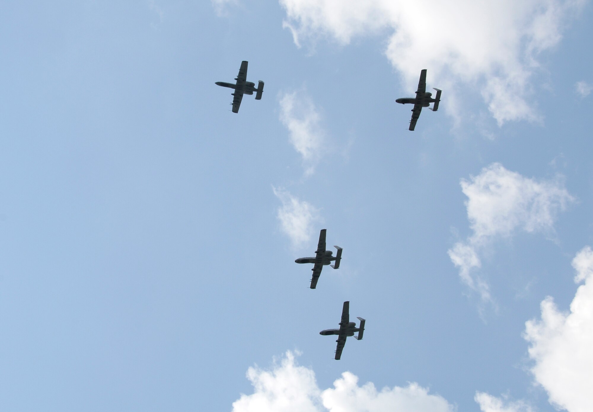 A four-ship of A-10C Thunderbolt II “Warthogs” with the Arkansas Air National Guard’s 188th Fighter Wing perform a missing man formation during a flyover to honor Capt. Virgil Meroney III during a repatriation ceremony held in Fayetteville, Ark., June 9, 2012. Meroney was missing in action during the Vietnam War after being shot down in his F-4D Phantom II aircraft, which crashed while carrying out a nighttime strike mission in Kahammouan Province, Laos. Meroney’s remains were identified May 24 and were returned to his family for burial with full military honors. Col. Mark Anderson, 188th Fighter Wing commander; Lt. Col. Brian Burger, 188th Operations Group commander; Maj. Justin Lewis; and Capt. Mark Cox performed the flyover.  (National Guard photo by Airman 1st Class Hannah Landeros/188th Fighter Wing Public Affairs)