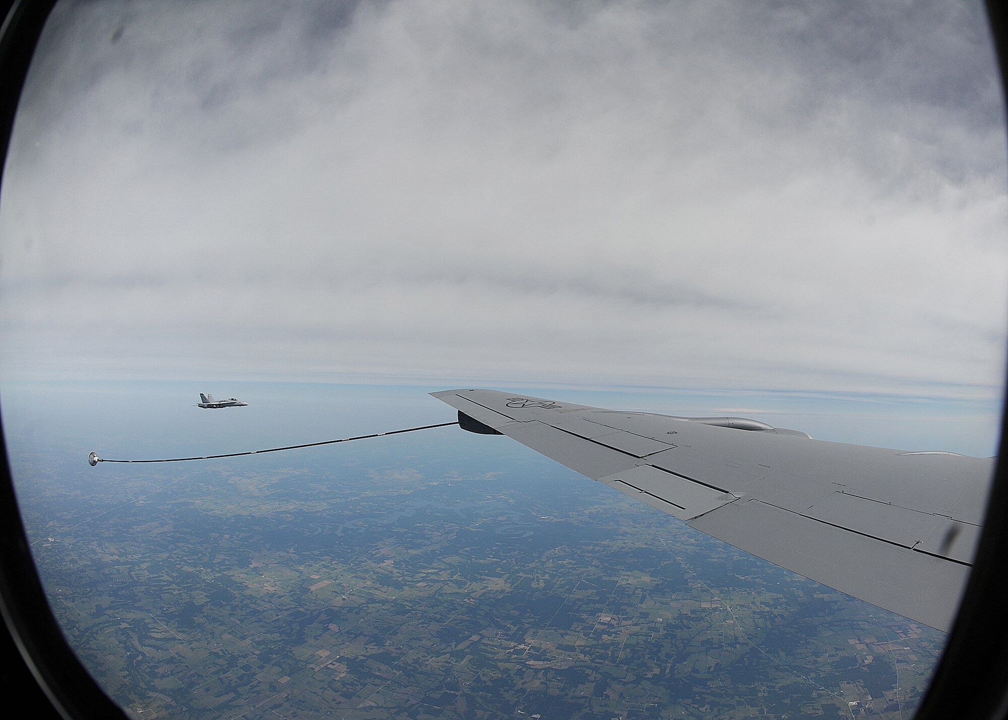 An F/A-18 Hornet from Naval Air Station Fort Worth Joint Reserve Base, Texas, prepares to receive fuel from a KC-135 Stratotanker June 13, 2012, McConnell Air Force Base, Kan. Col. Ricky Rupp, 22nd Air Refueling Wing commander, flew the tanker while four U.S. Air Force Academy cadets witnessed an in-flight refueling. McConnell’s primary mission is to provide Global Reach, conducting air refueling and airlift missions where and when needed. (U.S. Air Force photo/Airman 1st Class Katrina M. Brisbin)