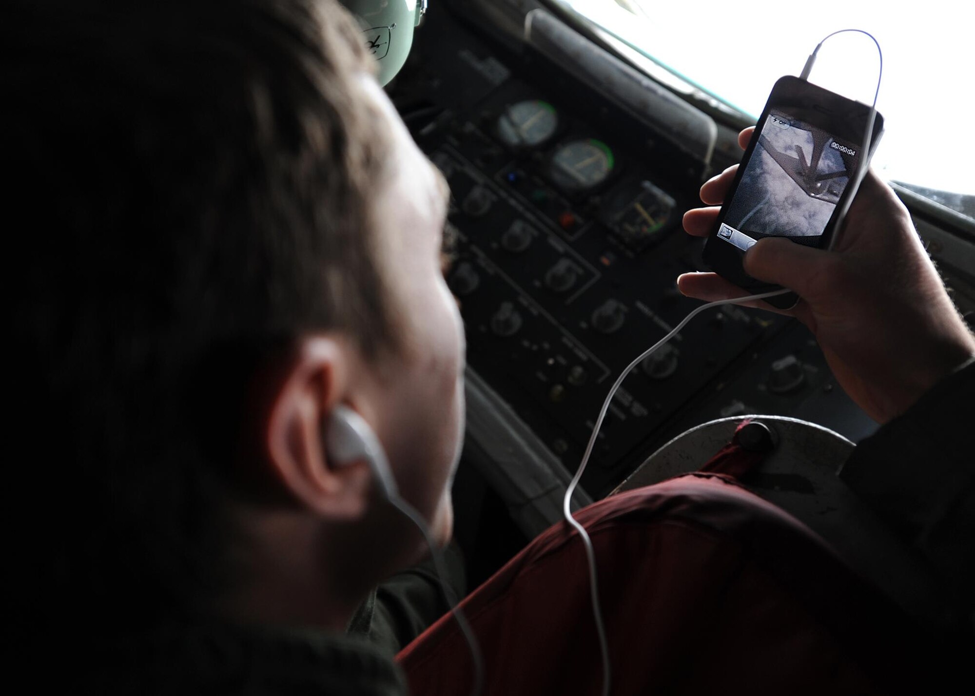 U.S. Air Force Academy Cadet 2nd Class George Michalke records a video of a McConnell KC-135 Stratotanker refueling a B-2 Spirit June 11, 2012, McConnell Air Force Base, Kan. Every summer, cadets visit bases worldwide to learn about the Air Force mission as well as the specific missions of the maintenance, support, medical and operations groups. (U.S. Air Force photo/Airman 1st Class Katrina M. Brisbin)