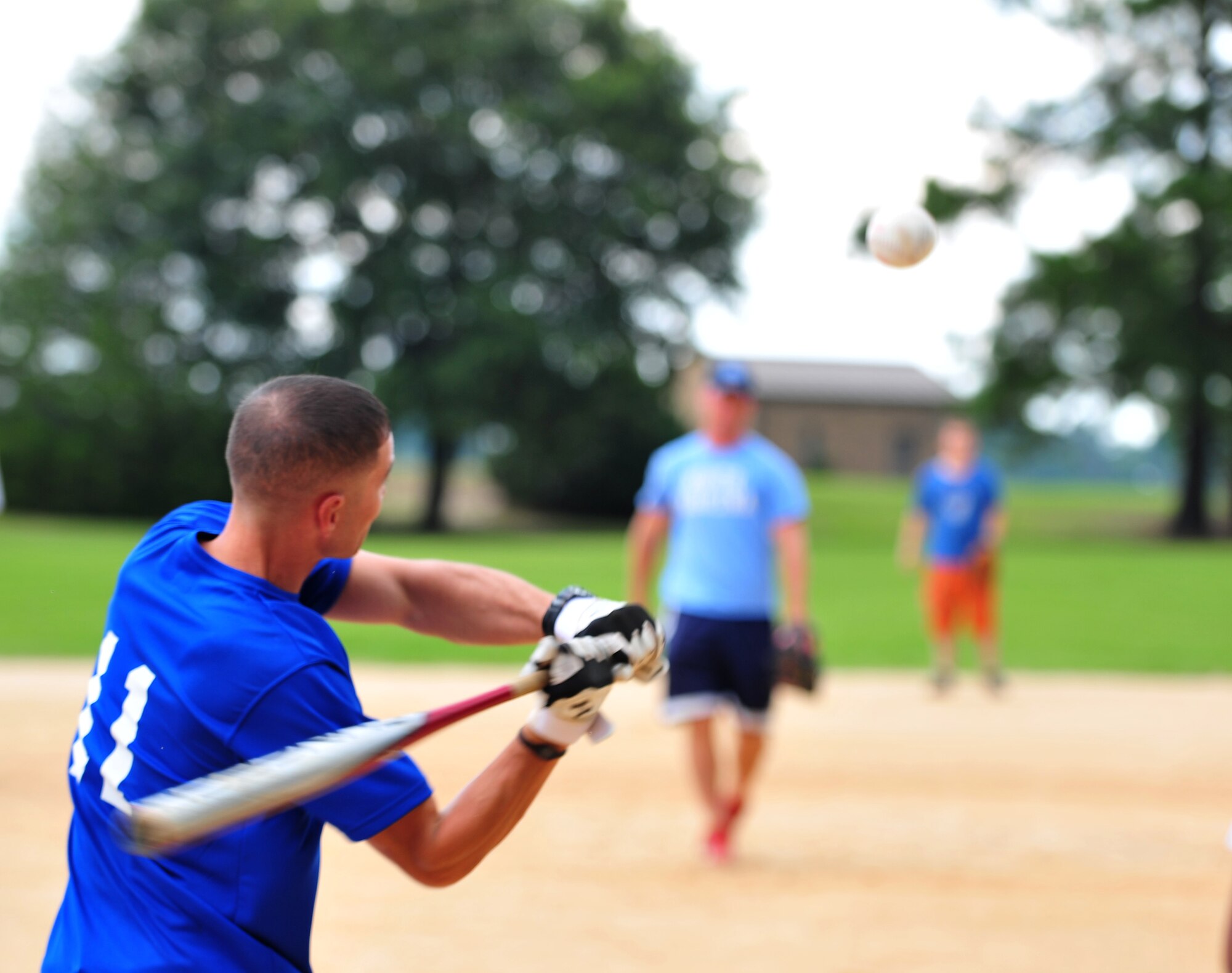 Michael Cherry, 23d Civil Engineer Squadron, swings at a ball during the 23d Mission Support Group sports day at Moody Air Force Base, Ga., June 14, 2012.  Airmen and their families played various sports including volleyball and horseshoes for an afternoon of relaxation and unit bonding. (U.S. Air Force photo by Staff Sgt. Stephanie Mancha/Released)