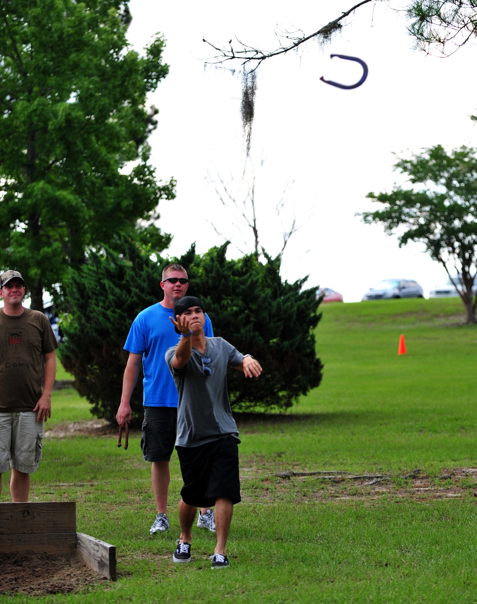 Eric Tom, 23d Force Support Squadron, competes in a game of horseshoes during the 23d Mission Support Group sports day at Moody Air Force Base, Ga., June 14, 2012. The event was filled with sporting games, food and music for Airmen to unwind and take a break from the work they do on a day-to-day basis. (U.S. Air Force photo by Staff Sgt. Stephanie Mancha/Released)