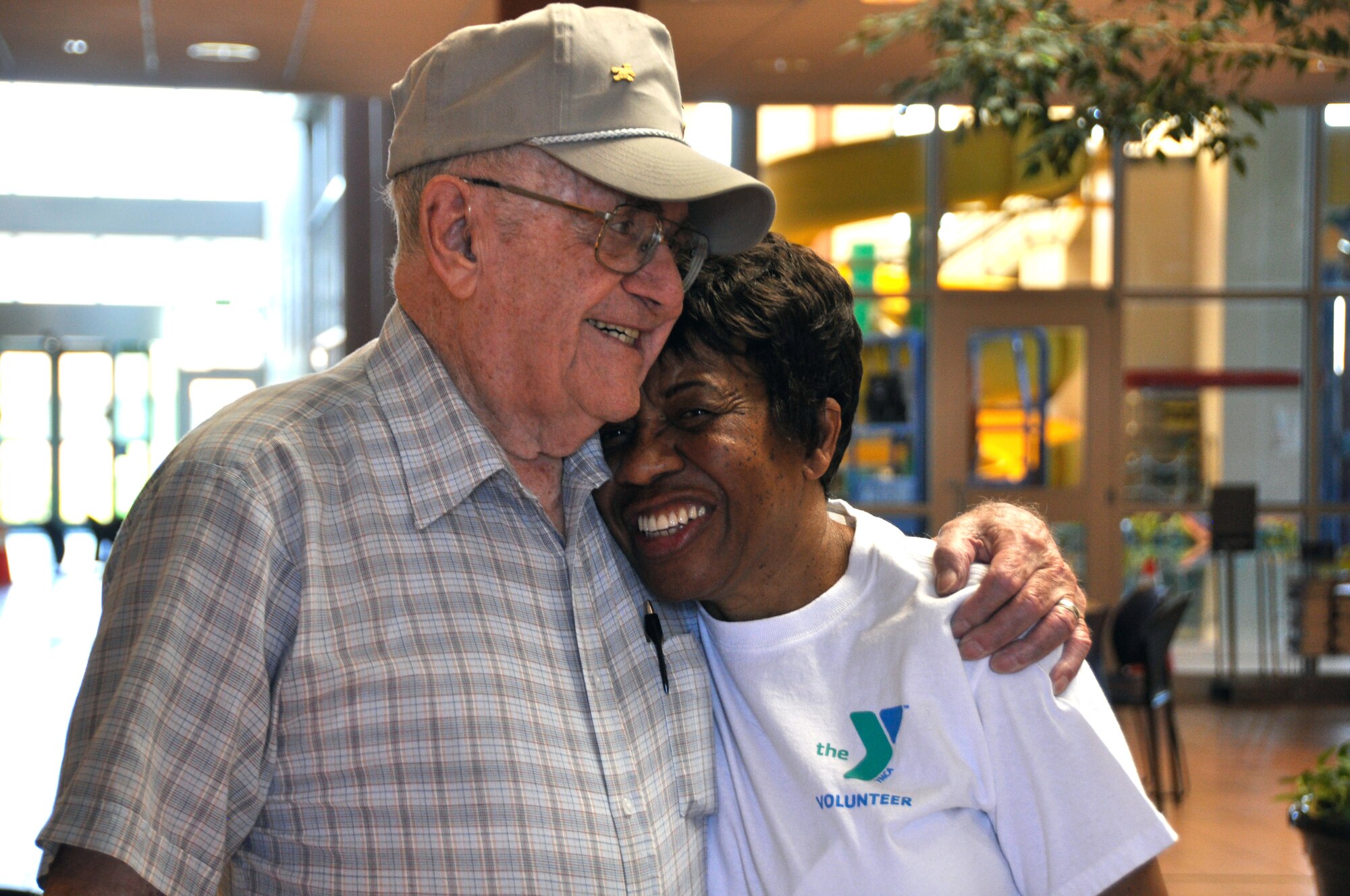 Jeanne Stanley (right), a spouse of a retiree and volunteer at the YMCA, receives a hug from a patron at the YMCA on Jet Wing Drive in Colorado Springs. Stanley said she volunteers for a variety of organizations because she feels needed and takes pride in helping her community. (U.S. Air Force photo/Master Sgt. Genevieve Sills)