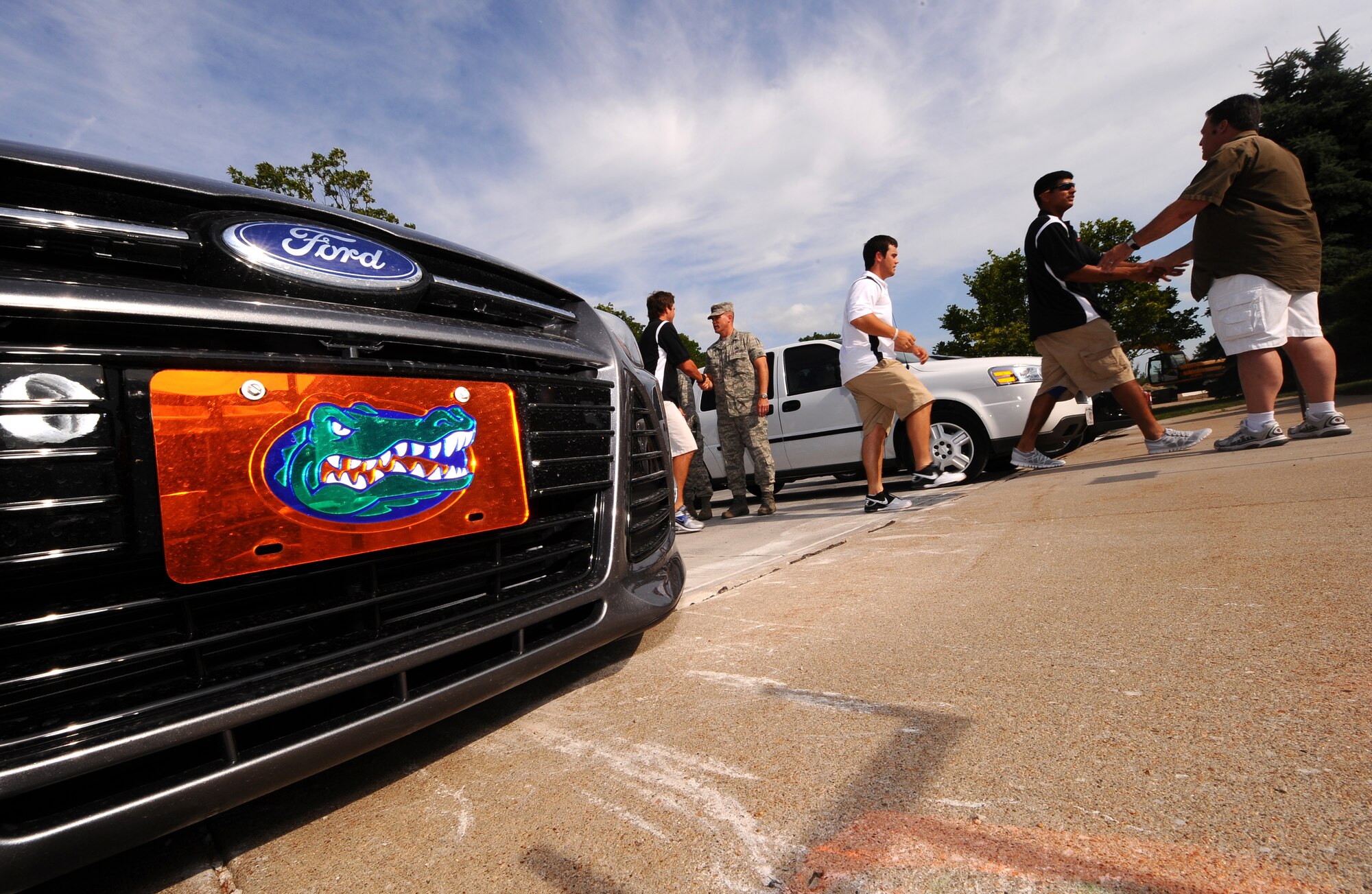 The University of Florida's baseball team exits their tour bus in route for the Patriot Club to meet with the men and women of the Fightin' Fifty-Fifth following their tour of Offutt Air Force, Neb., June 17.  The Gators are in the Omaha metro area to compete in the 2012 College World Series. (U.S. Air Force photo by Josh Plueger)