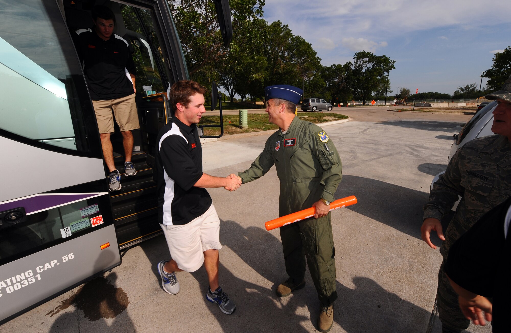 U.S. Air Force Brig. Gen. Donald Bacon, 55th Wing commander, greets the University of Florida's baseball team as they arrive at the Patriot Club for a buffet dinner and meet and greet with local area fans June 17, at Offutt Air Force Base, Neb.  Every year the wing sponsors a College World Series team giving them a tour of the base as well as dinner.  (U.S. Air Force photo by Josh Plueger)