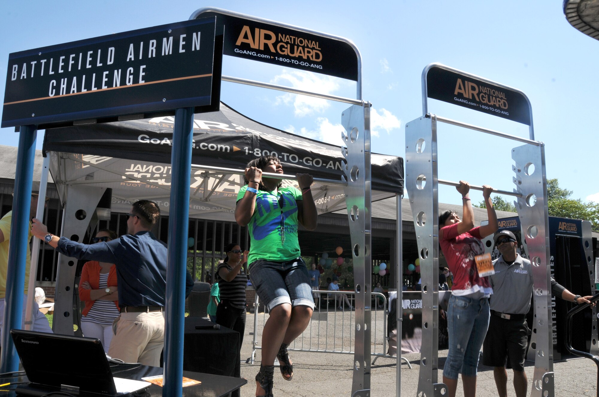 Friends and family of Air National Guard Readiness Center members participate in a chin-up challenge during a summer picnic in Mount Vernon, Virginia on June 15, 2012. (National Guard photo by Tech. Sgt. Melissa E. Chatham)