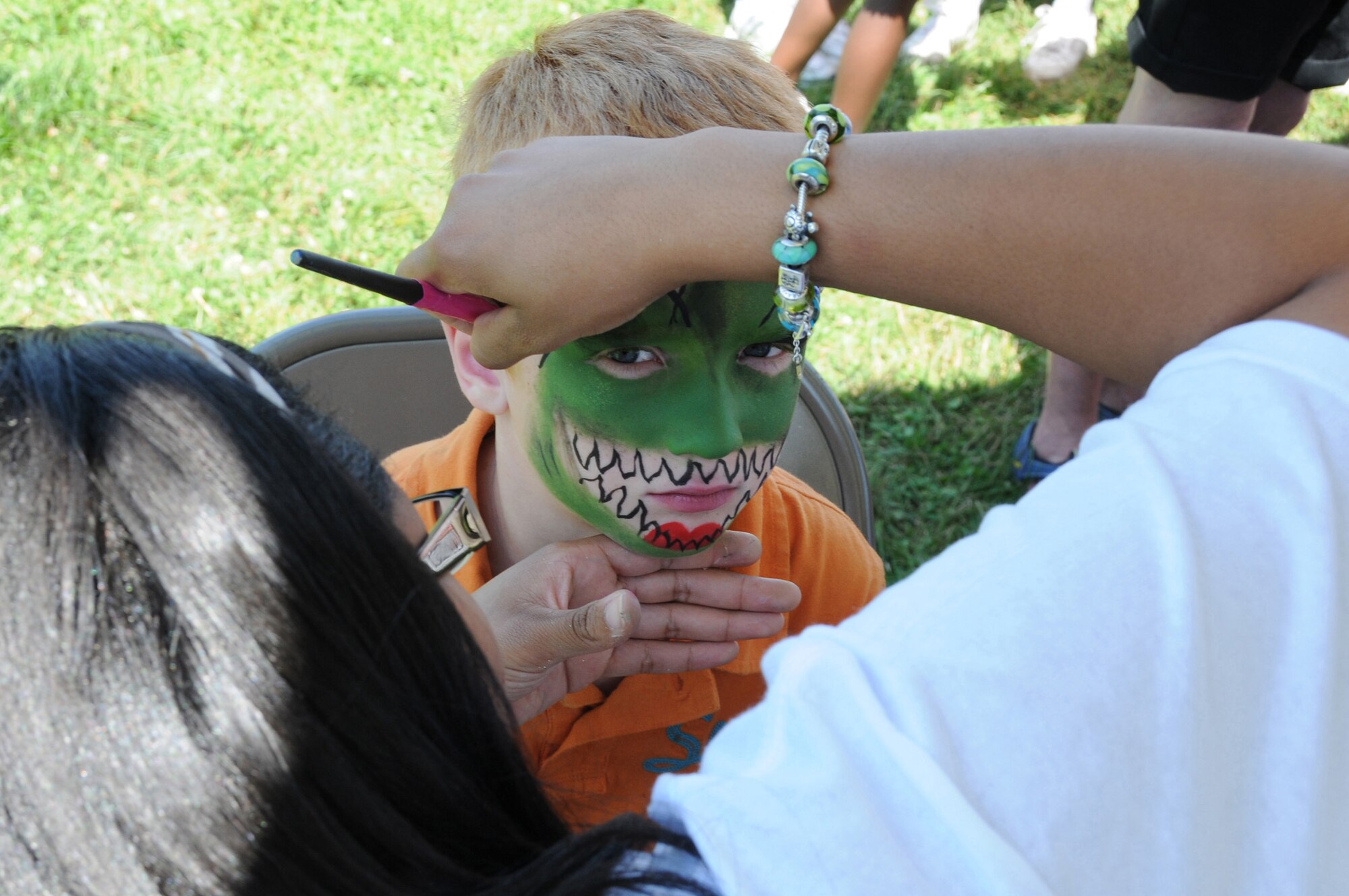 Face painting was one of the activities offered to members of the Air National Guard Readiness Center along with friends and family during a summer picnic in Mount Vernon, Virginia on June 15, 2012.  (National Guard photo by Tech. Sgt. Melissa E. Chatham)