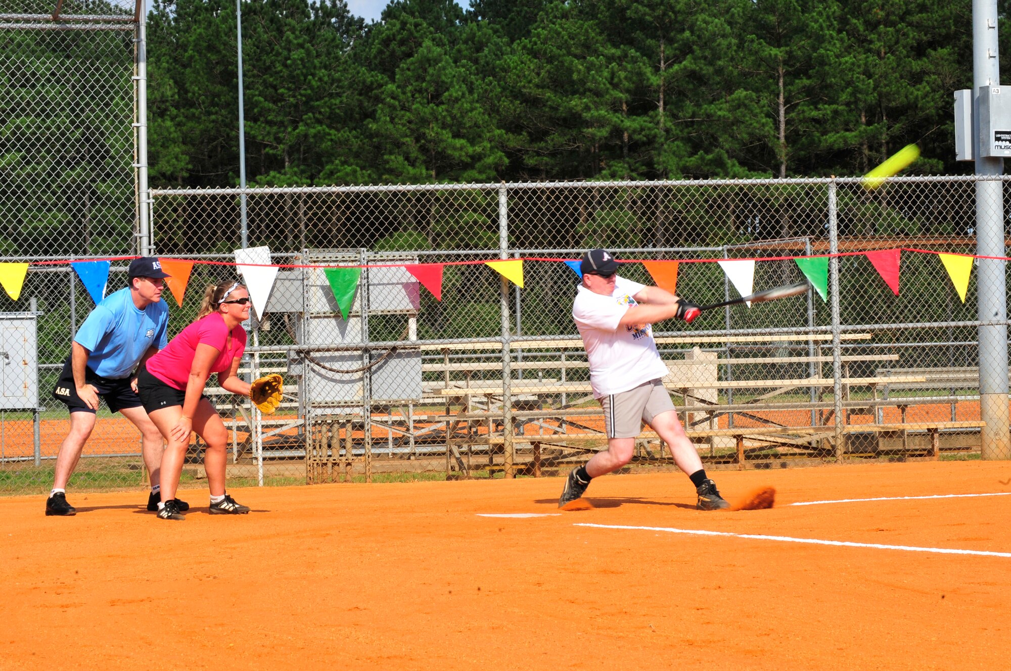 U.S. Air Force Chief Master Sgt. Eric Hall, 20th Dental Squadron superintendent, hits the ball during the Chiefs vs. Eagles softball game, Shaw Air Force Base, S.C., June 18, 2012.  The Chiefs were the 2012 winners.(U.S. Air Force Airman Nicole Sikorski/Released)