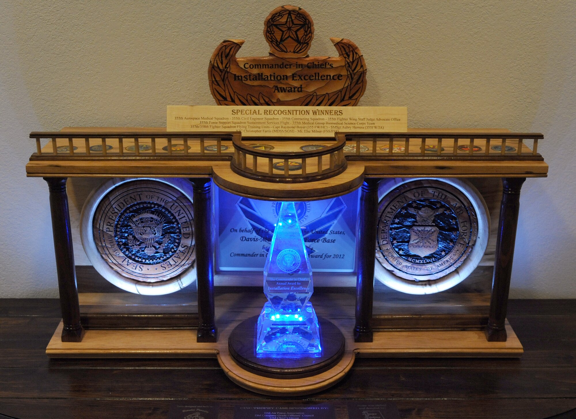 The 2012 Commander-in-Chief Installation Excellence Award display stands in front of the conference room of the 355th Fighter Wing headquarters on Davis-Monthan Air Force Base, Ariz., June 19, 2012. The display was designed by U.S. Air Force Staff Sgt. Brandon Paradise, 355th Maintenance Operations Squadron, and Erika Jansen of Design Etching and Awards. (U.S. Air Force photo by Airman 1st Class Timothy D. Moore/Released)